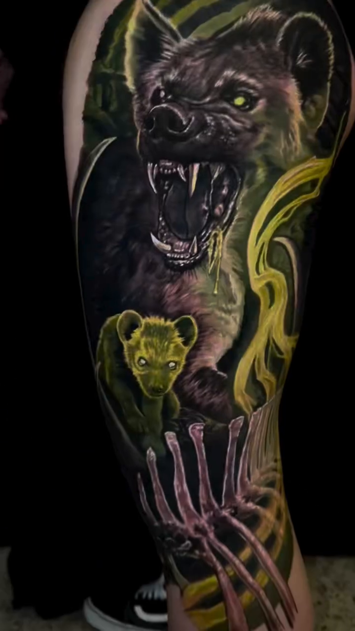 Hyena and cub realism tattoo by Caitlyn Campbell