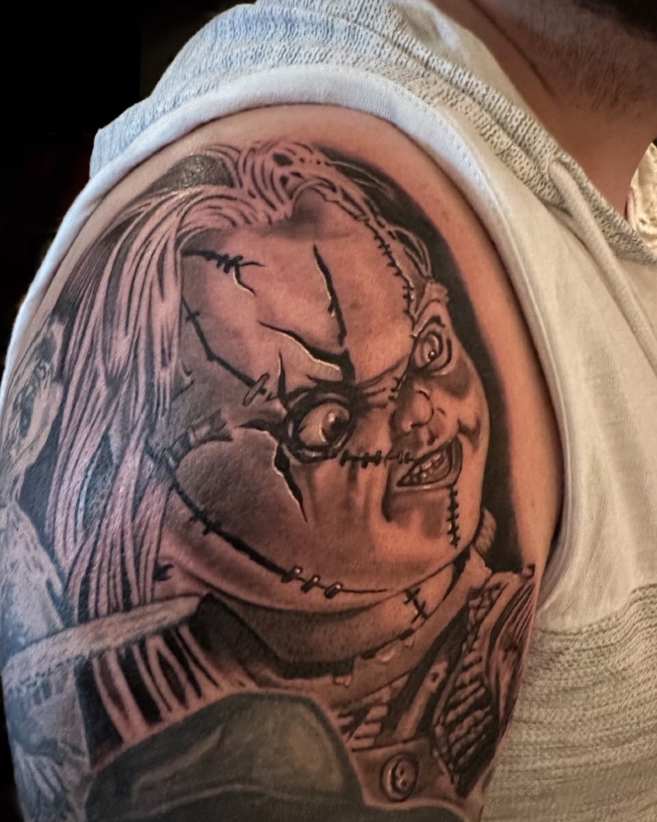 Chucky black and grey tattoo on the shoulder by las vegas tattoo artist