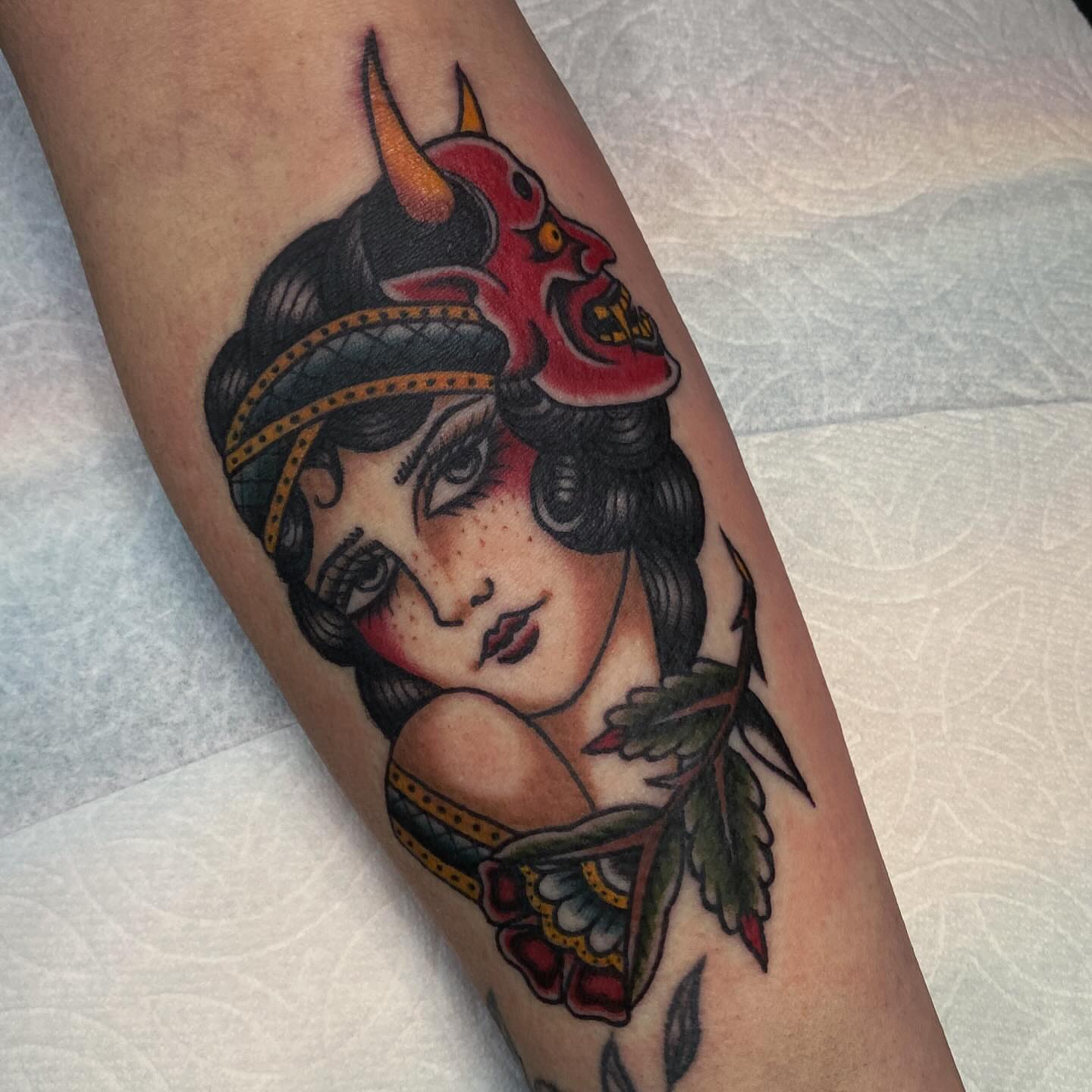 Woman with devil horns American traditional tattoo on the forearm by Lindsey Cam Van