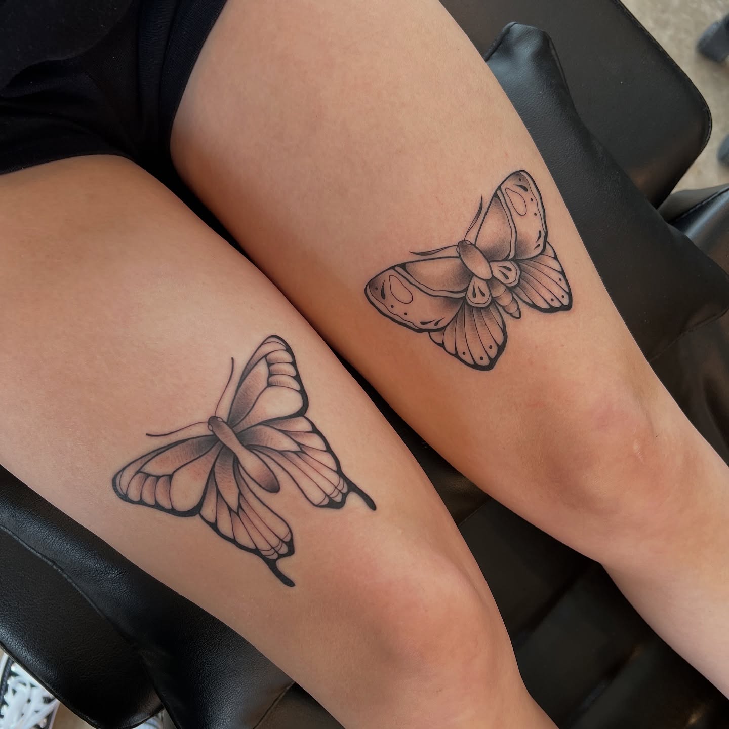 Butterfly black and grey tattoo on the thigh by Dom