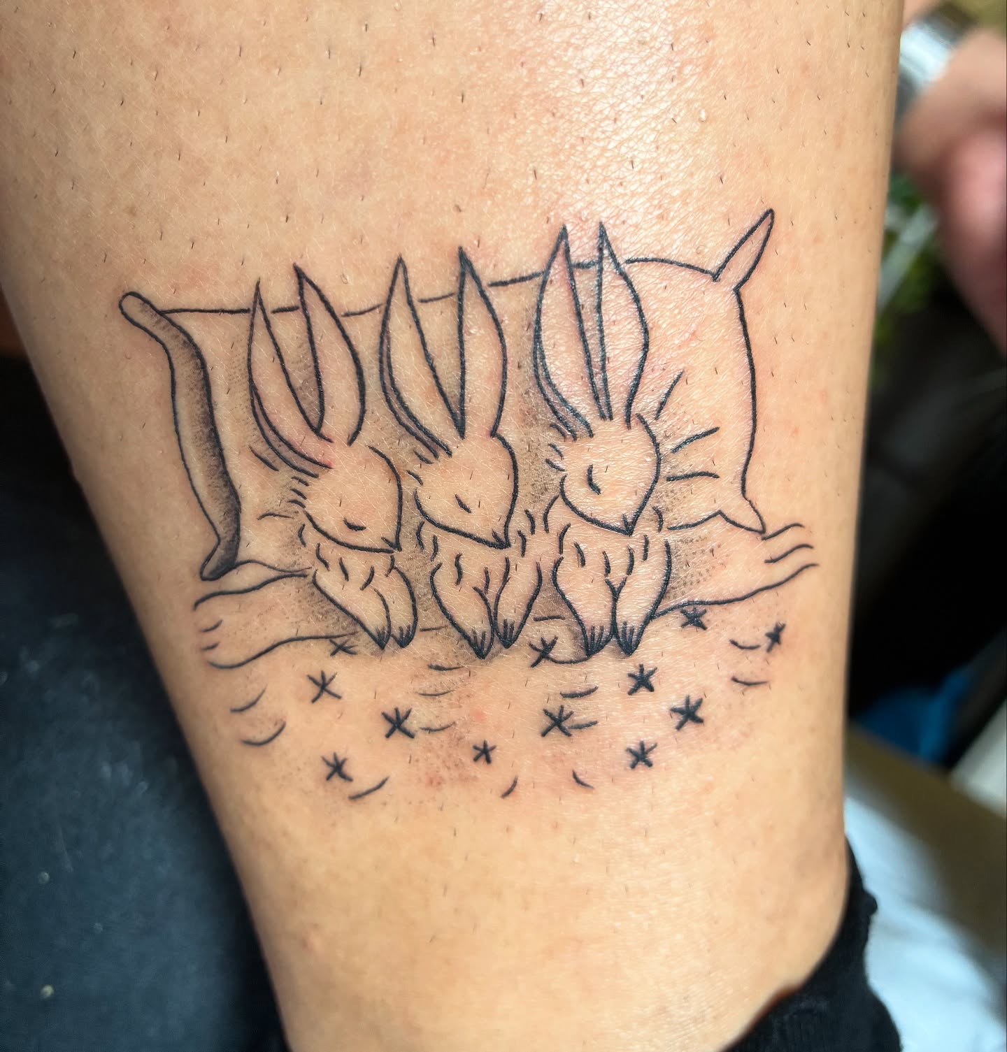 Rabbits dotwork tattoo on the thigh by Steph Liebetreu