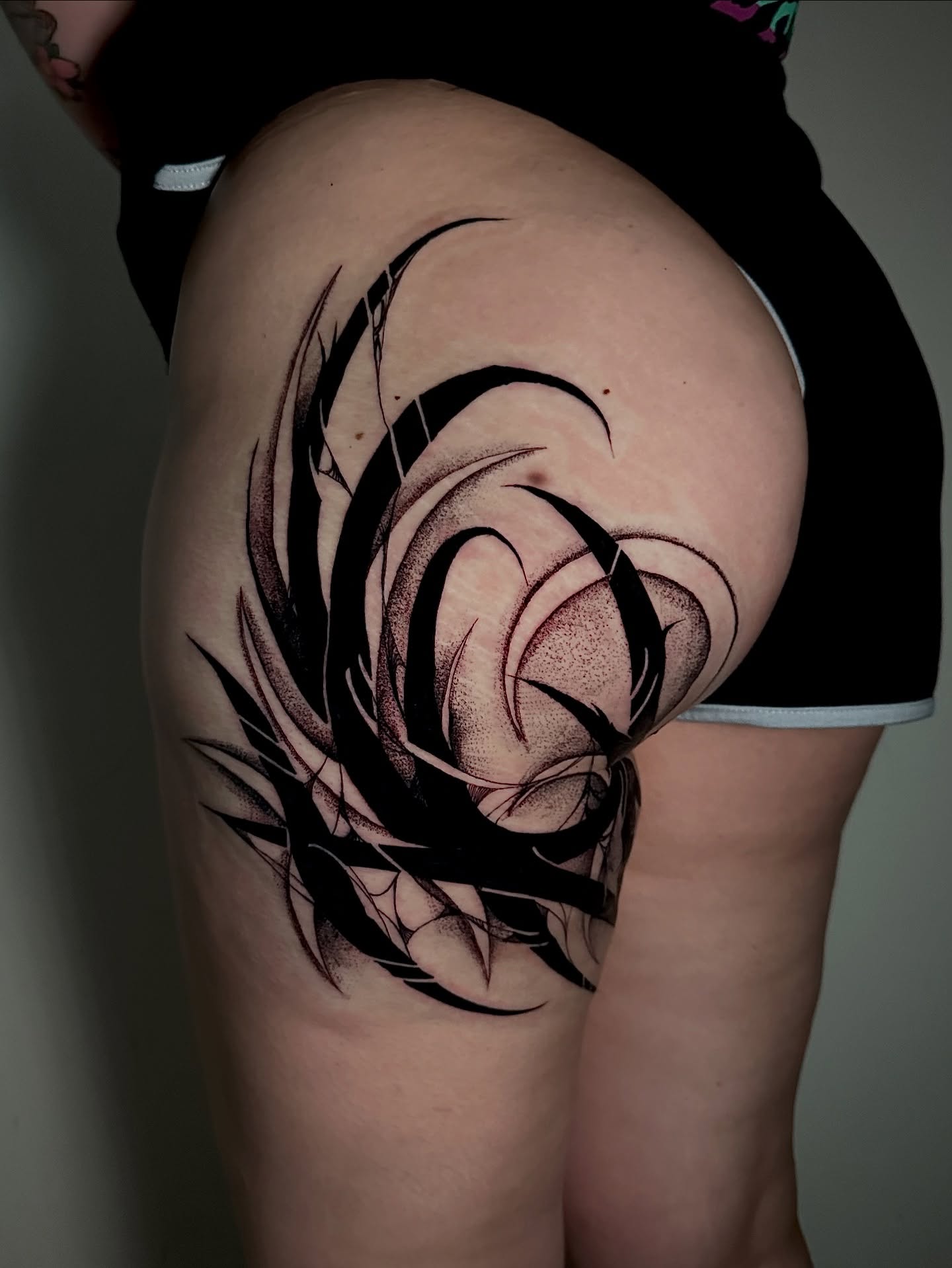 Abstract swirl dotwork tattoo on the thigh by Crystal, Las Vegas, Nevada