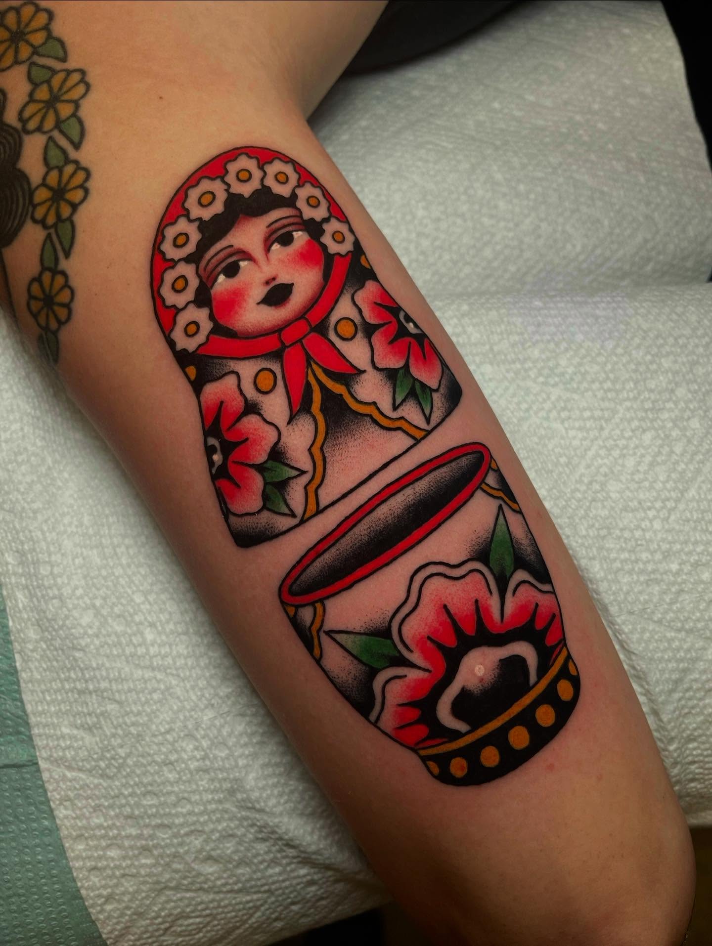 Matryoshka doll American traditional tattoo on the forearm by Marqui Watling