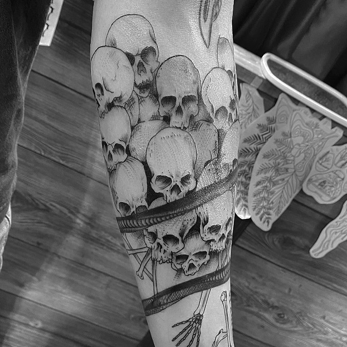 Skulls realism tattoo on the calf by Spencer Jones Tattoos