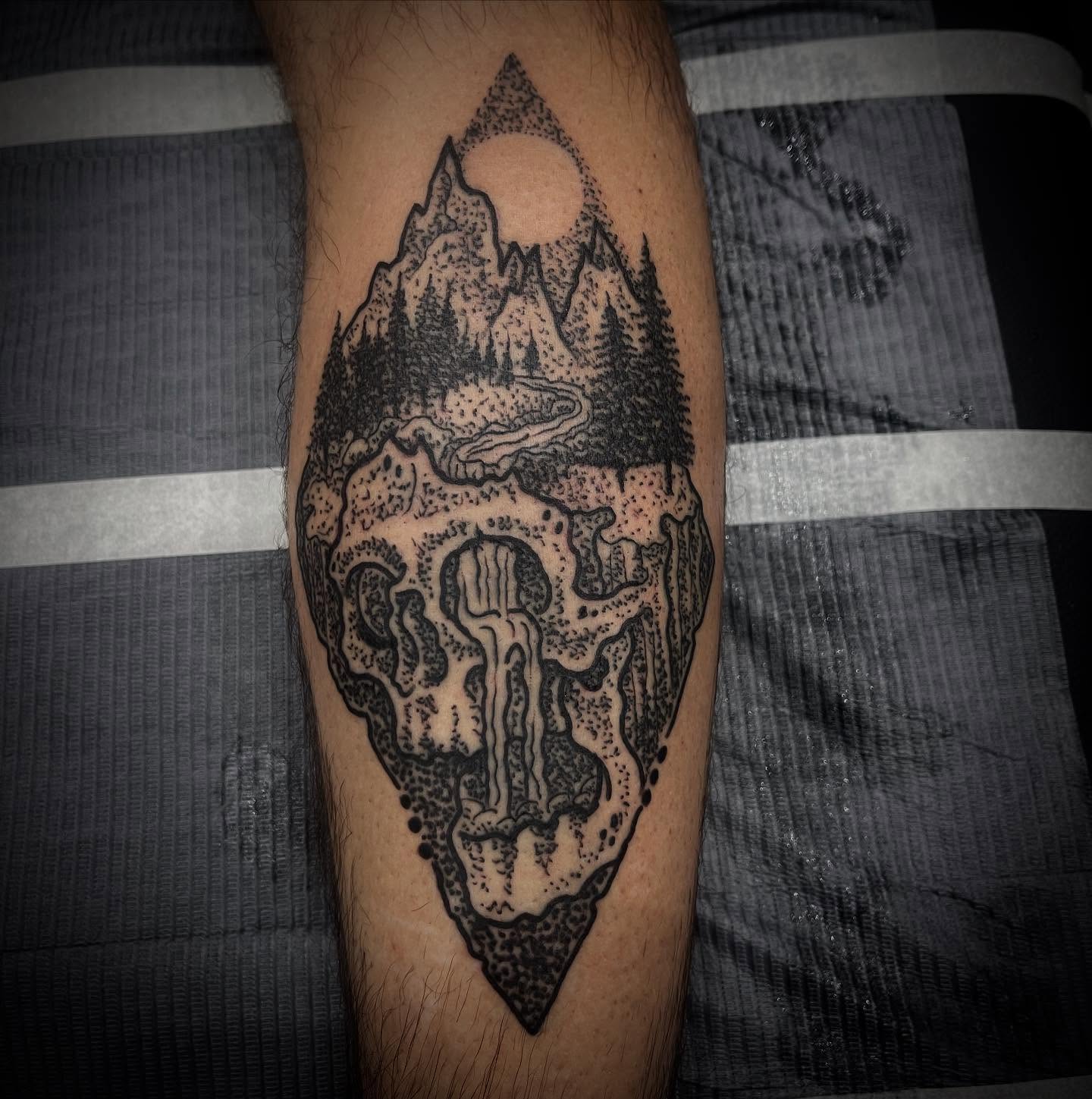 Mountain landscape dotwork tattoo on the forearm by Don Juan