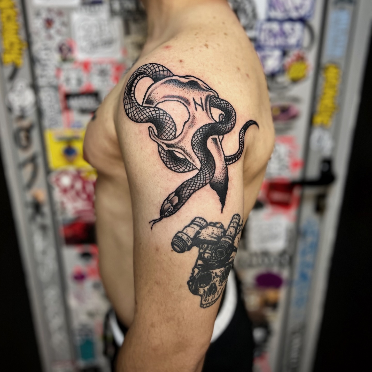 Snake and skull geometric tattoo on the shoulder by Comastein__________✍🏼️