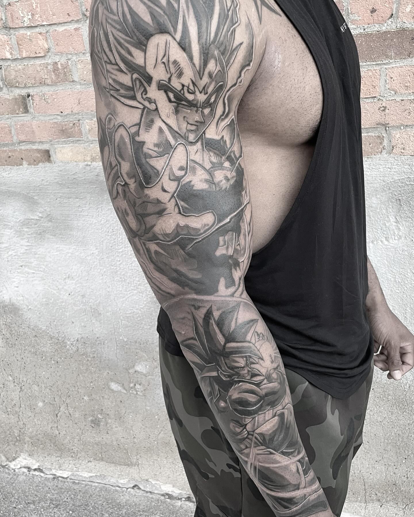 Dragon ball character realism tattoo on the upper arm by mike hudson