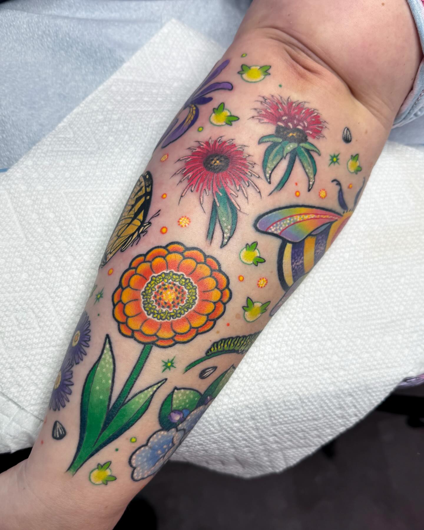 Floral bouquet American traditional tattoo on the forearm by Janine Ramos