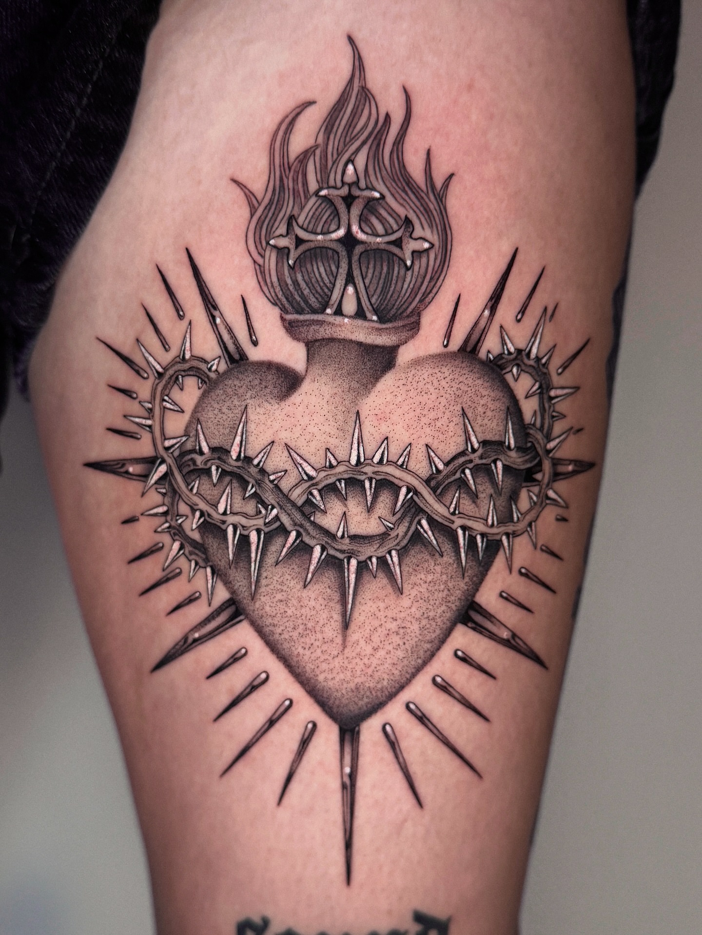 Heart with crown and thorns realism tattoo on the thigh by ella