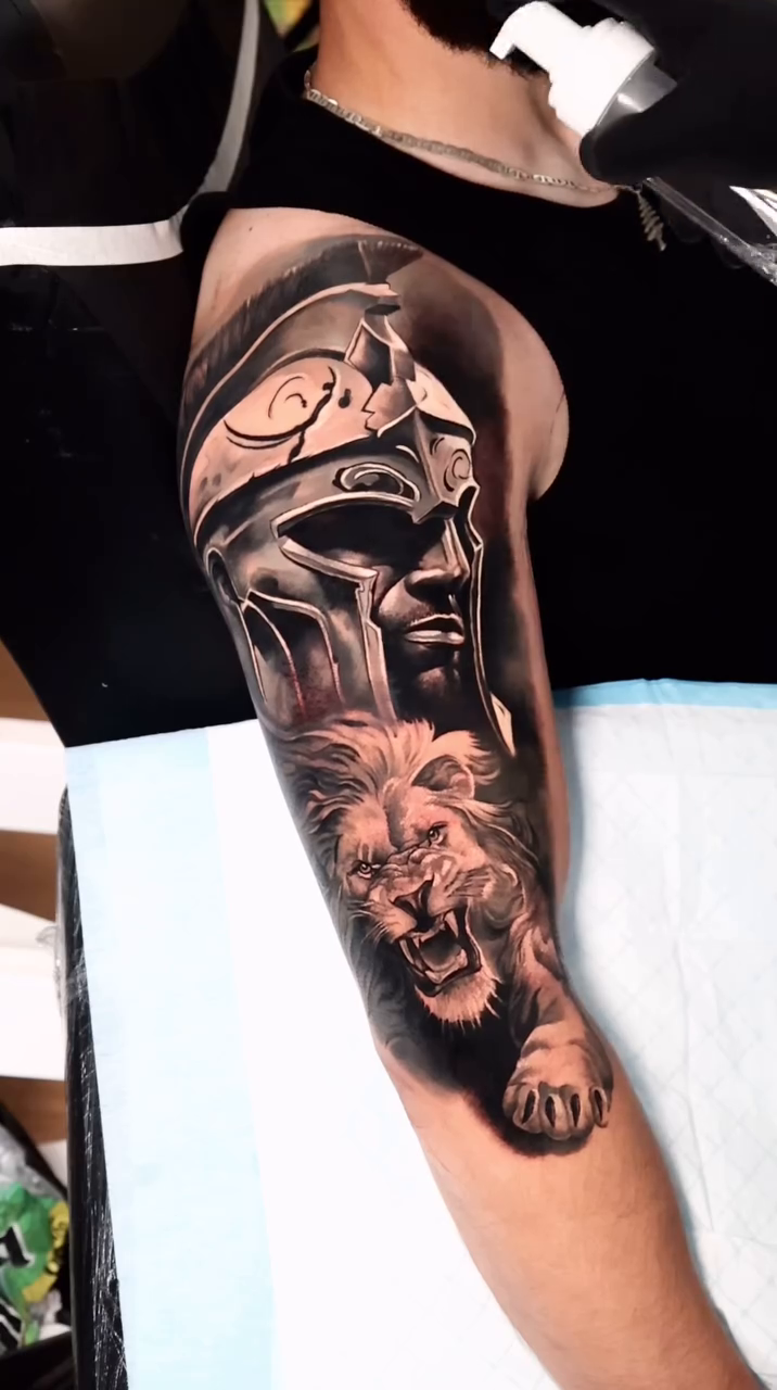 Spartan helmet and lion realism tattoo by Ali Saleh 🇱🇧 Detroit Tattoo Artist, Dearborn, Michigan