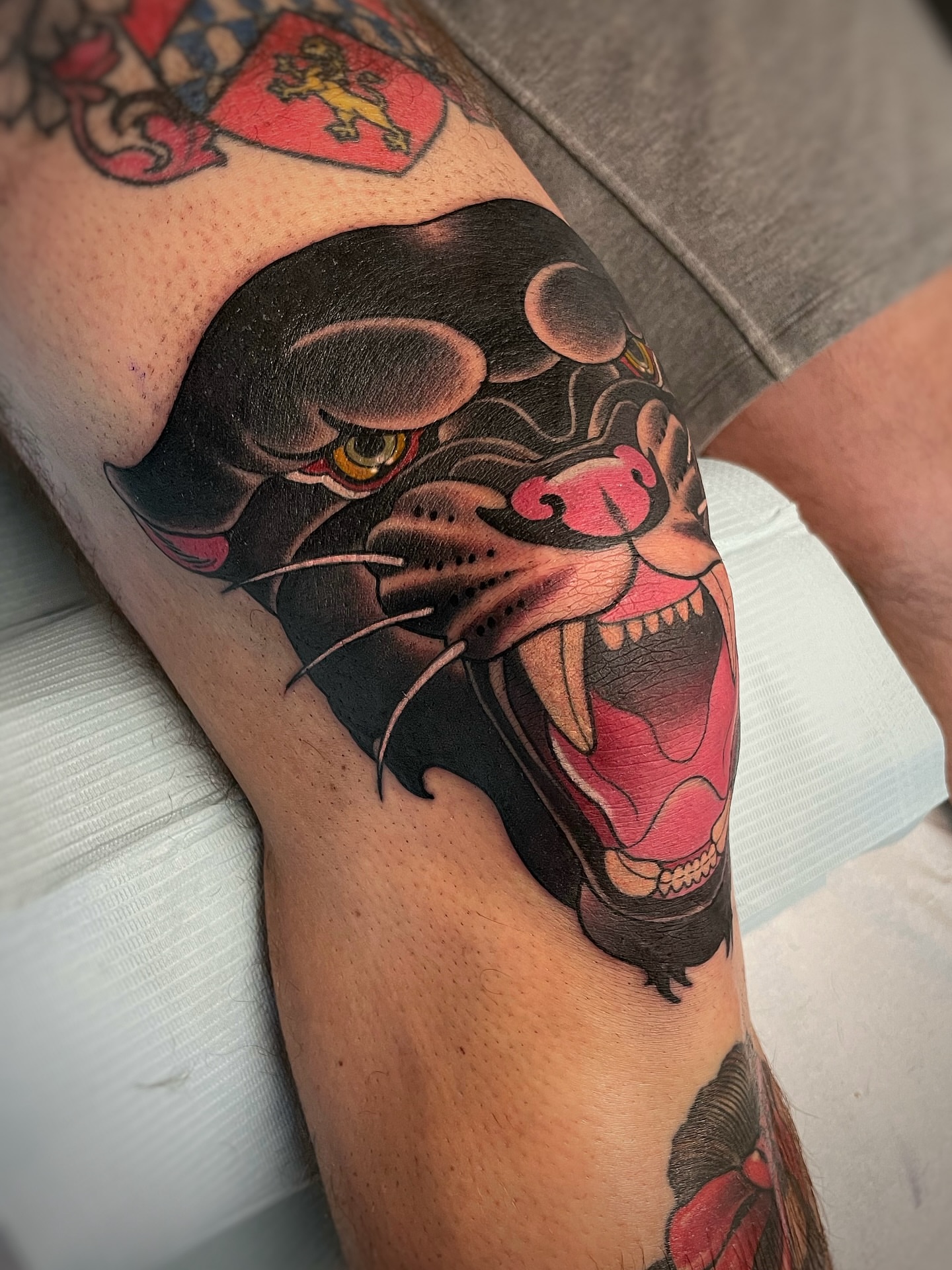 Panther American traditional tattoo on the thigh by Anne Cornelson