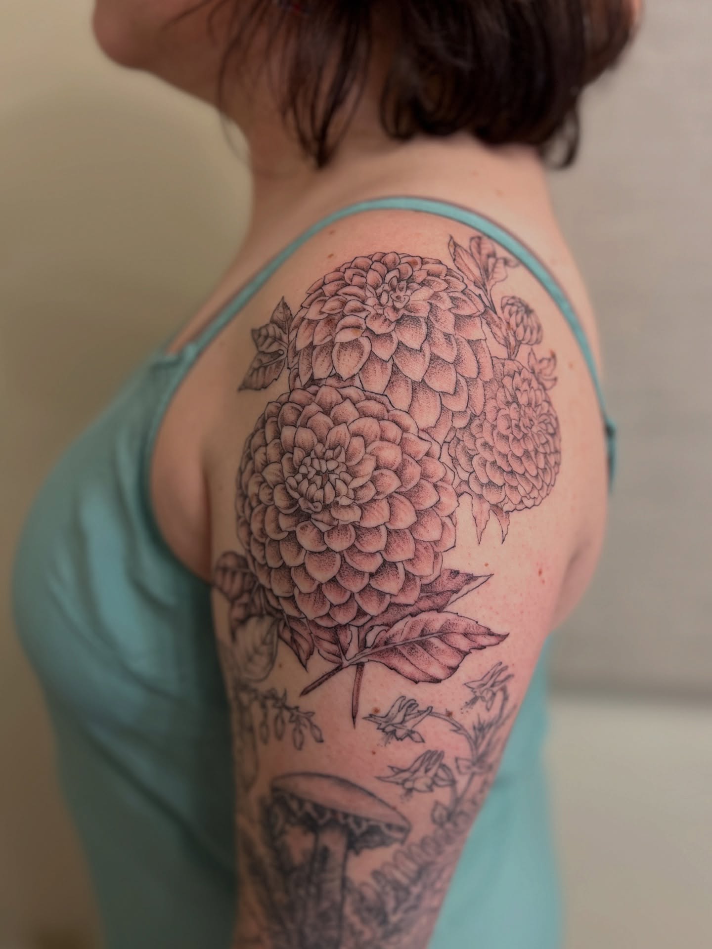 Dahlia flowers dotwork tattoo on the shoulder by Kelsi Hooper, Seattle, Washington