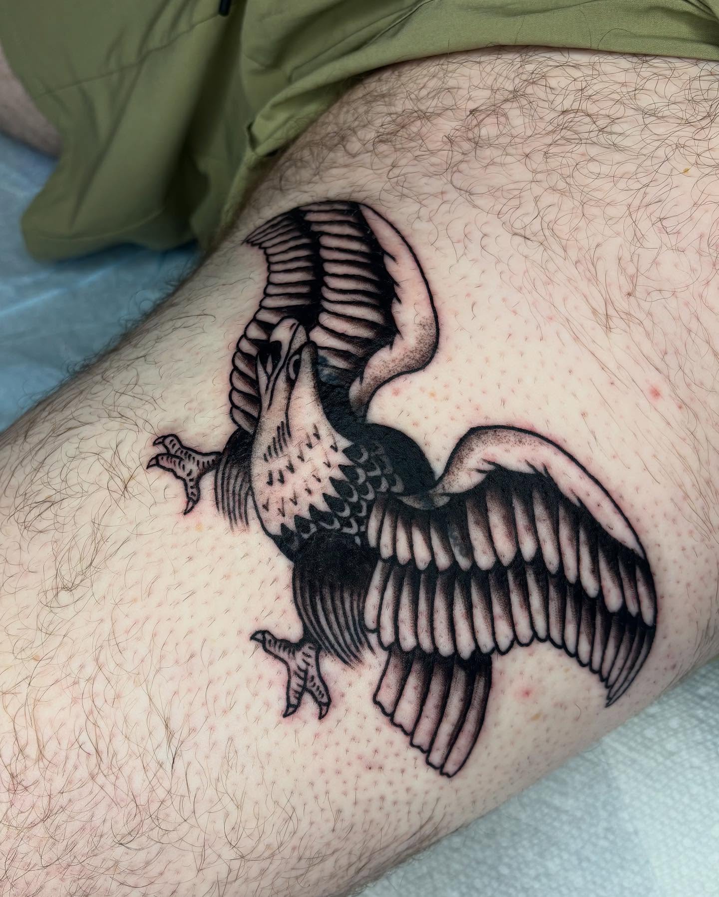 Vulture black and grey tattoo on the thigh by Emmy Gallagher