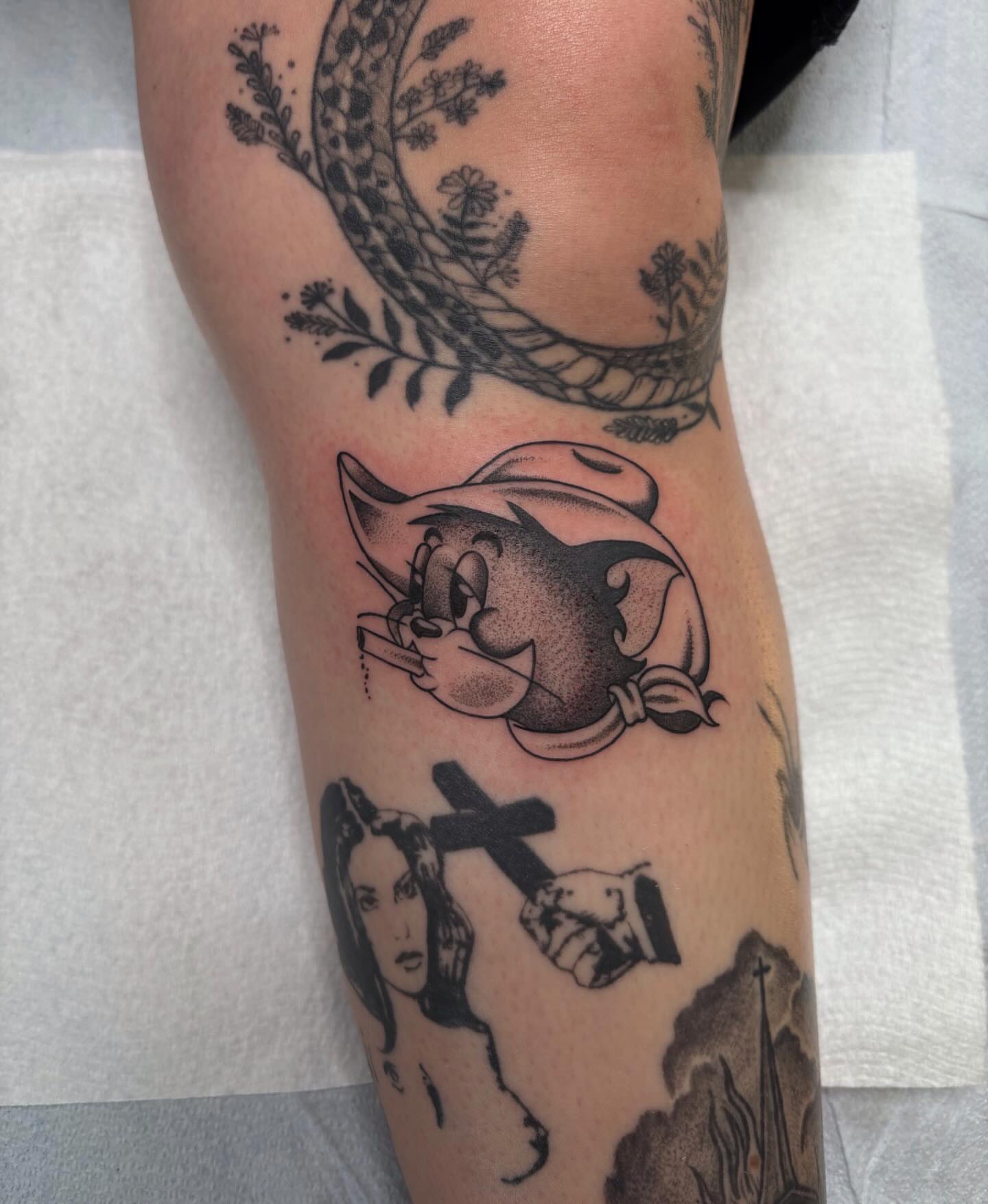 Tom and jerry dotwork tattoo on the forearm by Lily, Eugene, Oregon