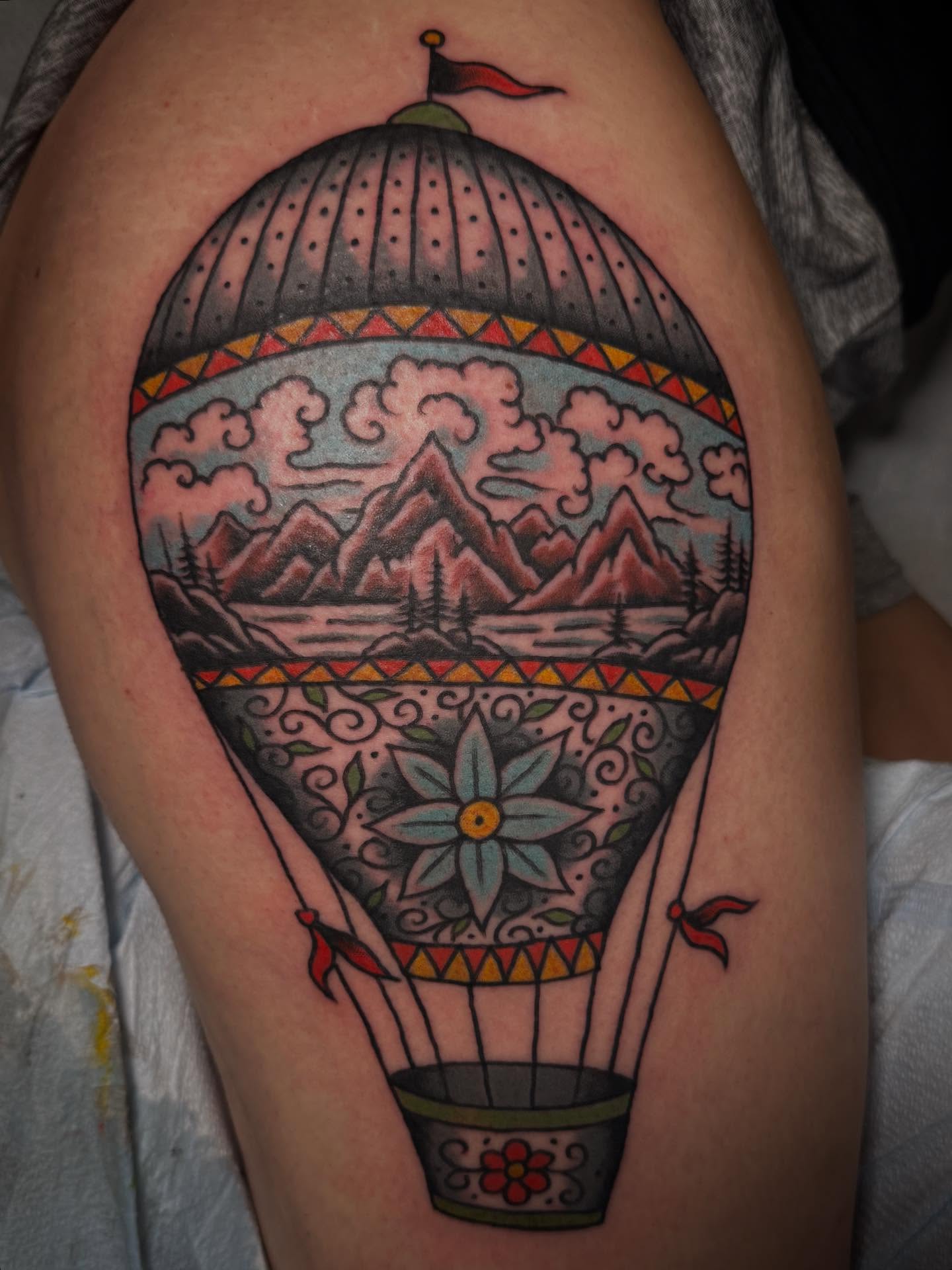 Hot air balloon American traditional tattoo on the thigh by Jesse Swanson, Santa Rosa, California