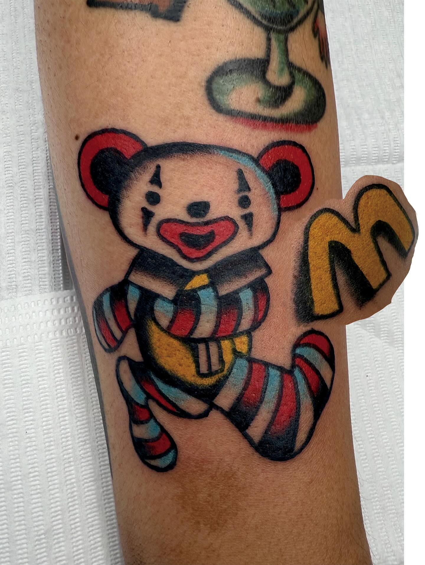 Teddy bear American traditional tattoo on the forearm by Jimmy Ho