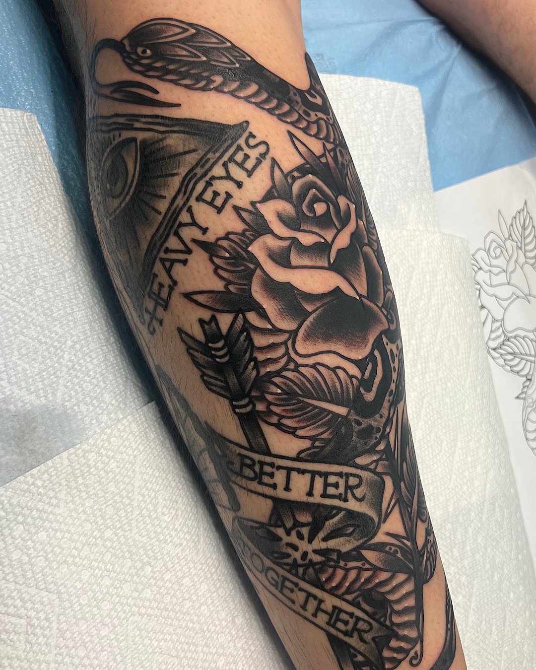 Rose and arrow black and grey tattoo on the forearm by @shannonkeeleyy