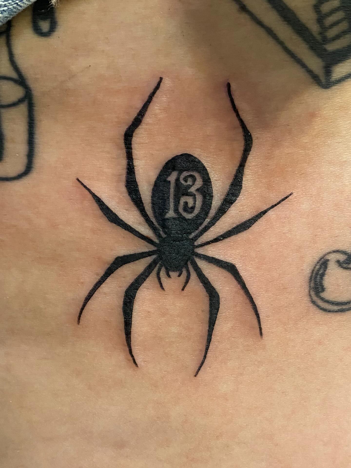 Spider black and grey tattoo on the chest by Drew