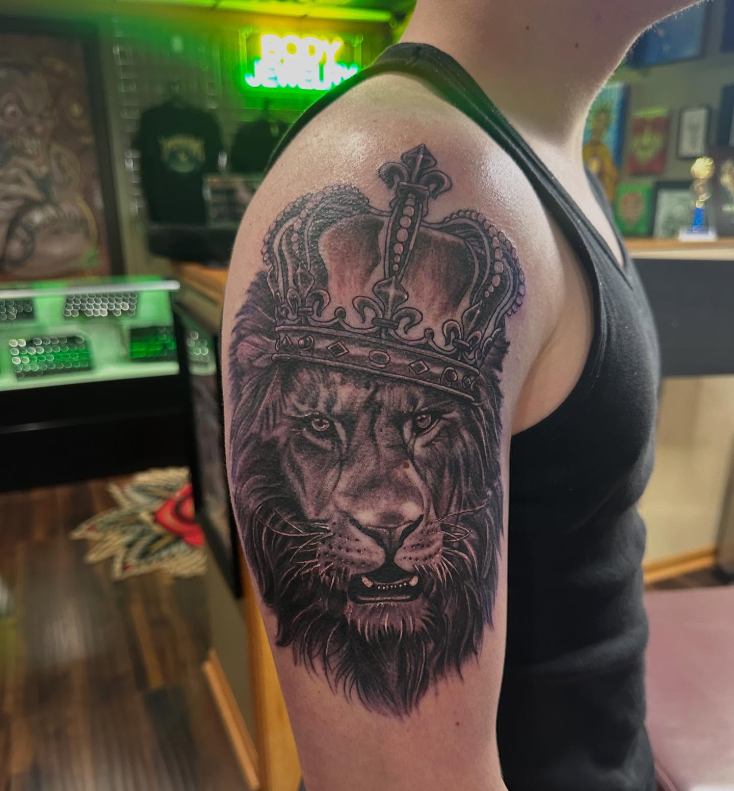 Lion with crown realism tattoo on the shoulder by George Zabala, Rockdale, Illinois