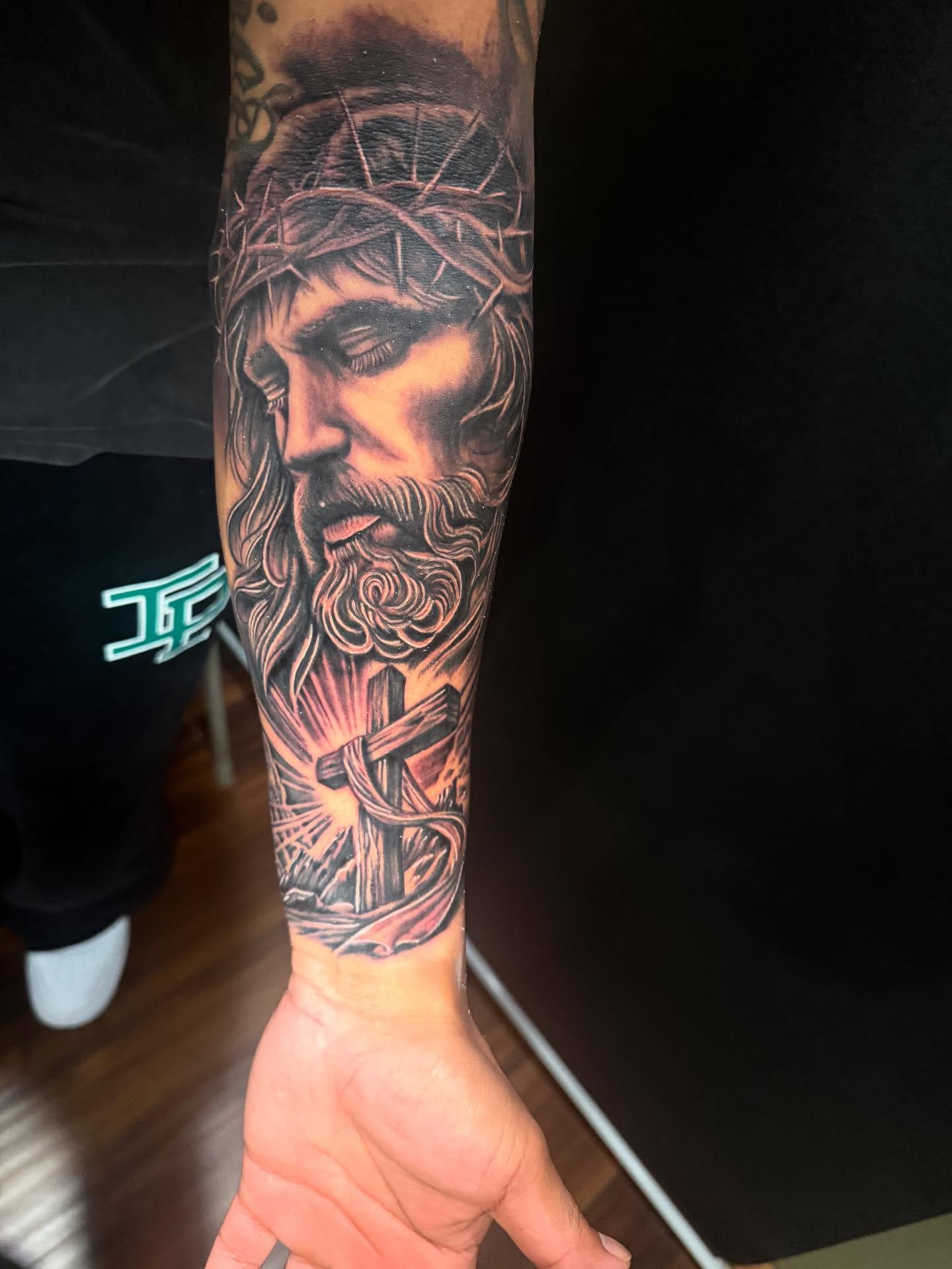 Jesus Christ realism tattoo on the forearm by George Zabala, Rockdale, Illinois