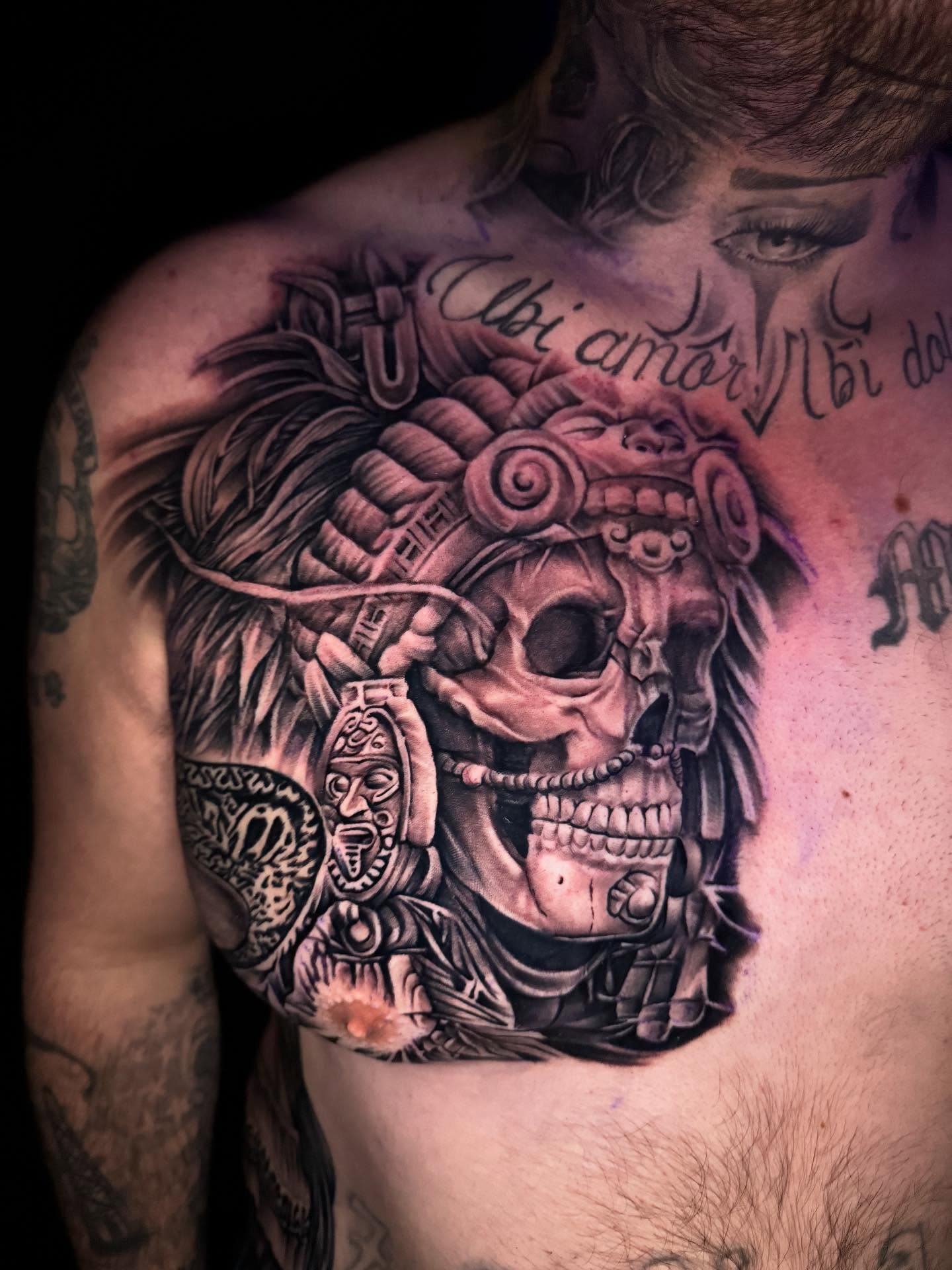 Skull with headdress realism tattoo on the chest by Tattoos By Chico