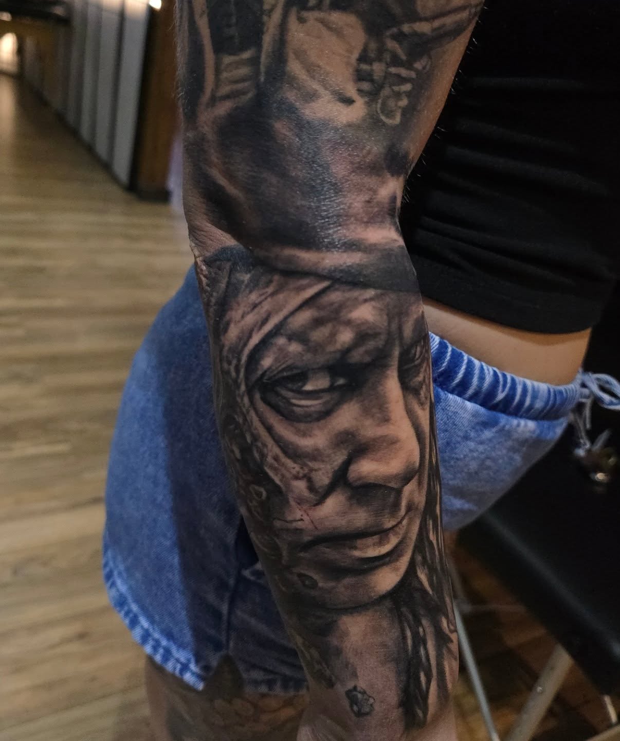 Portrait of a man realism tattoo on the forearm by Cody Lambert