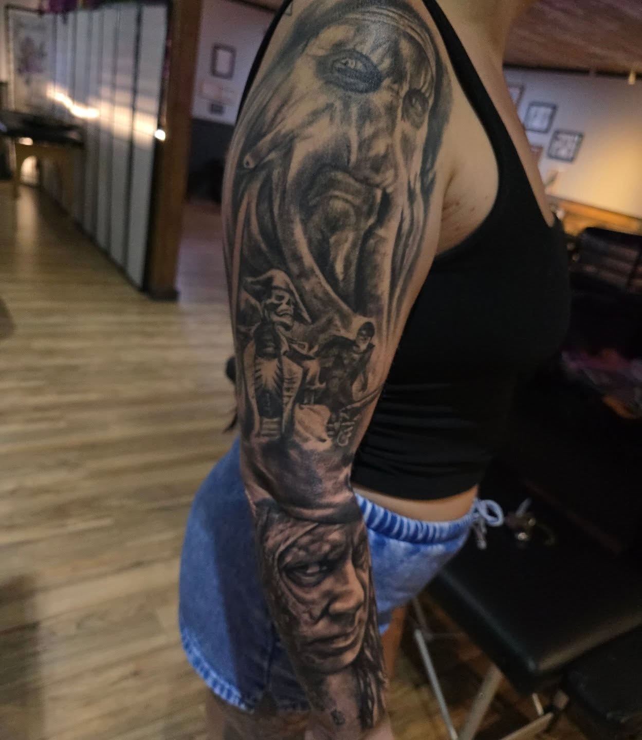 Pirate and horse realism tattoo on the upper arm by Cody Lambert
