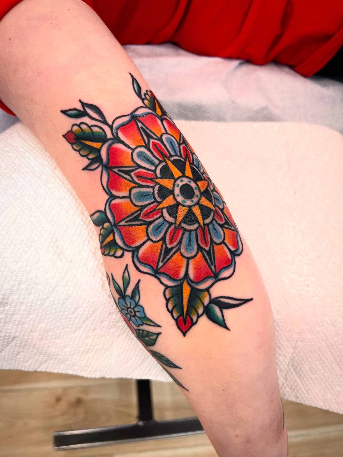 Floral mandala American traditional tattoo on the forearm by Shannon Pagliarini