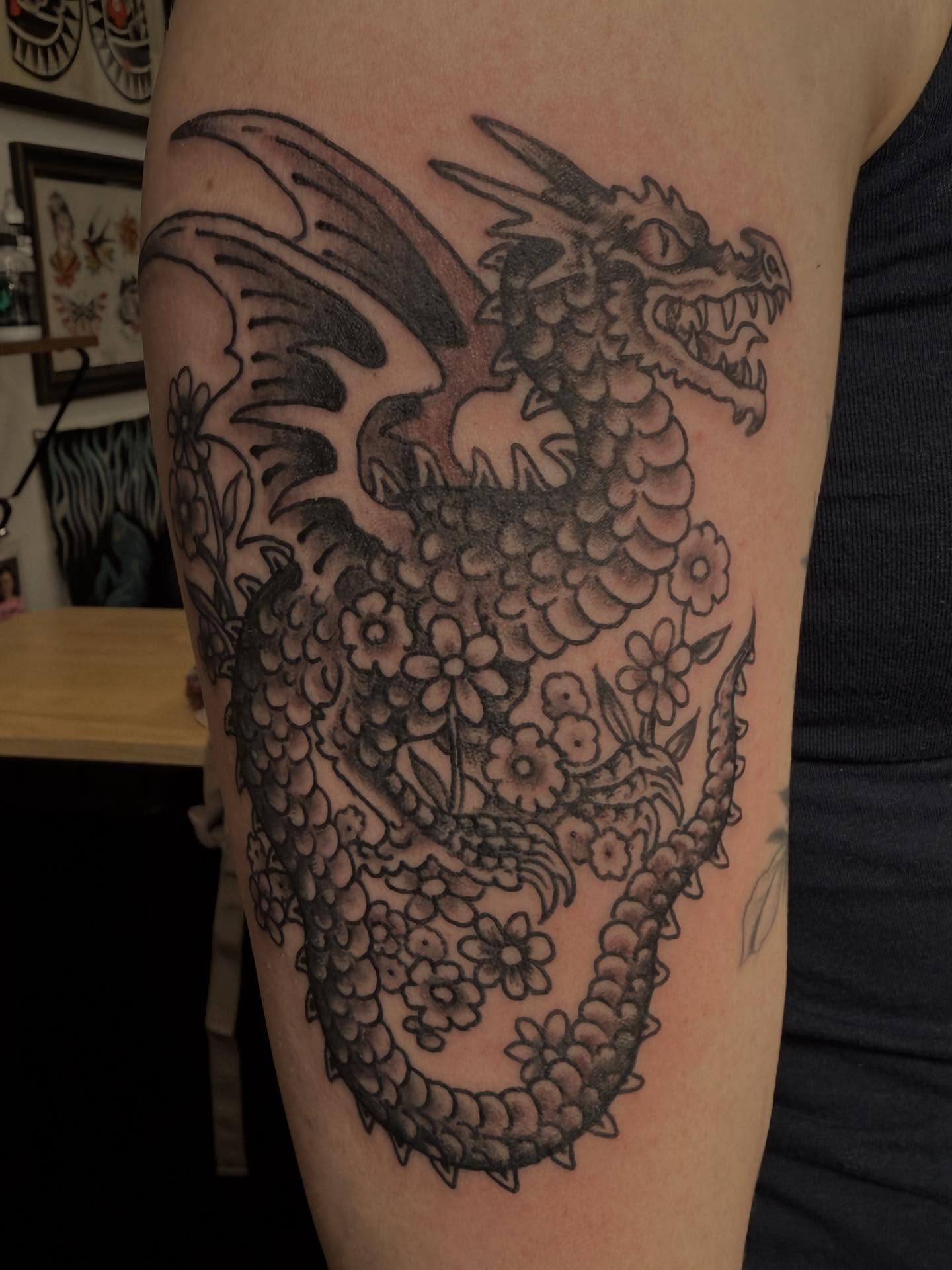 Dragon black and grey tattoo on the forearm by Jesse Swanson, Santa Rosa, California