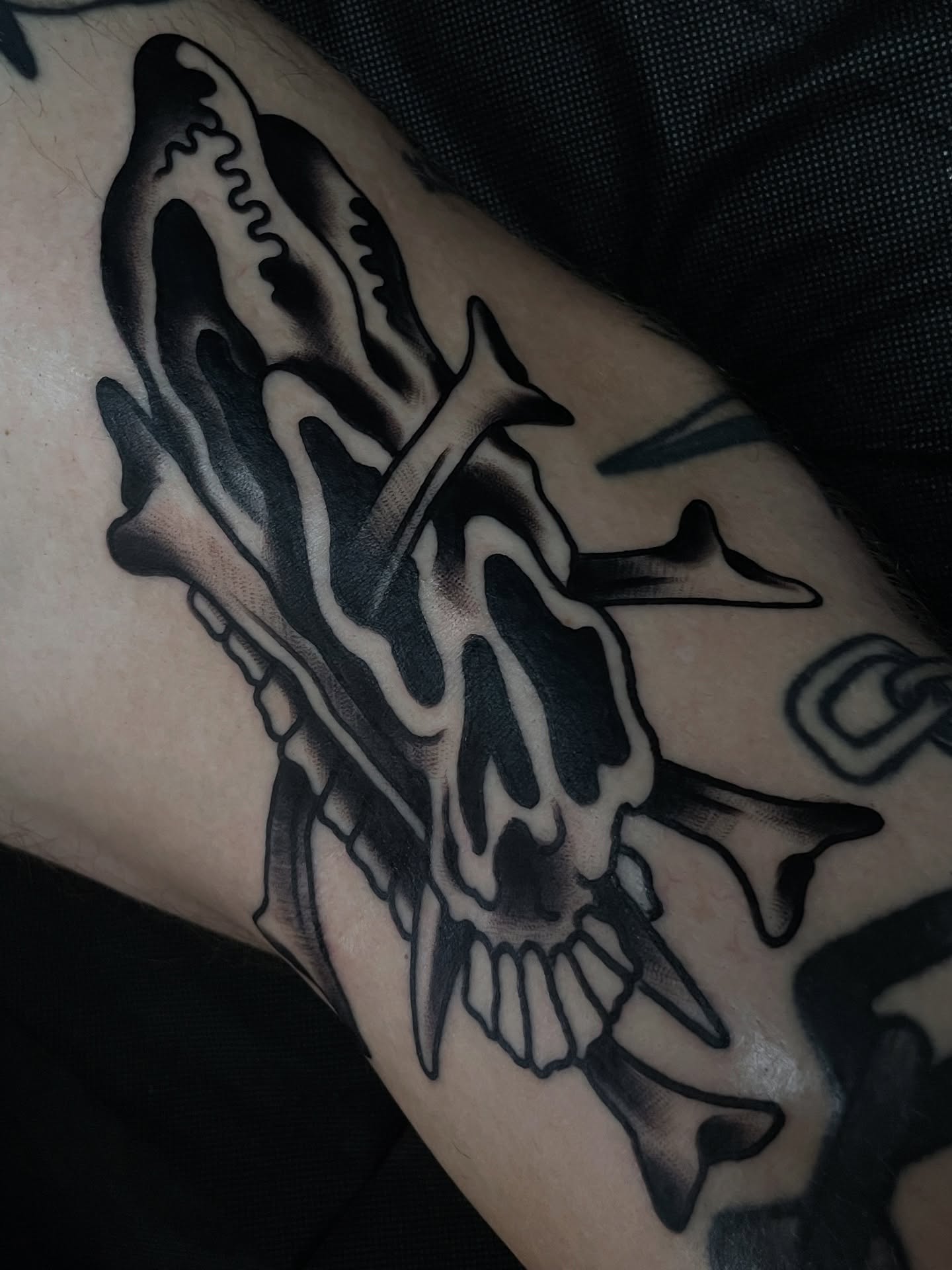 Skull black and grey tattoo on the forearm by Frank Mostek