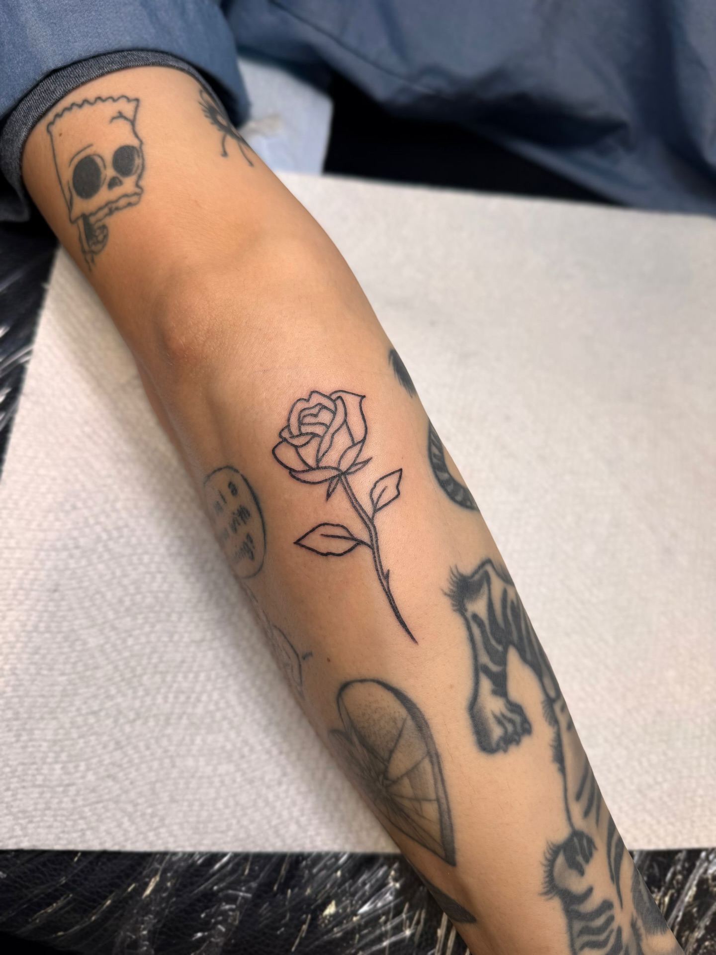 Rose black and grey tattoo on the forearm by Suda