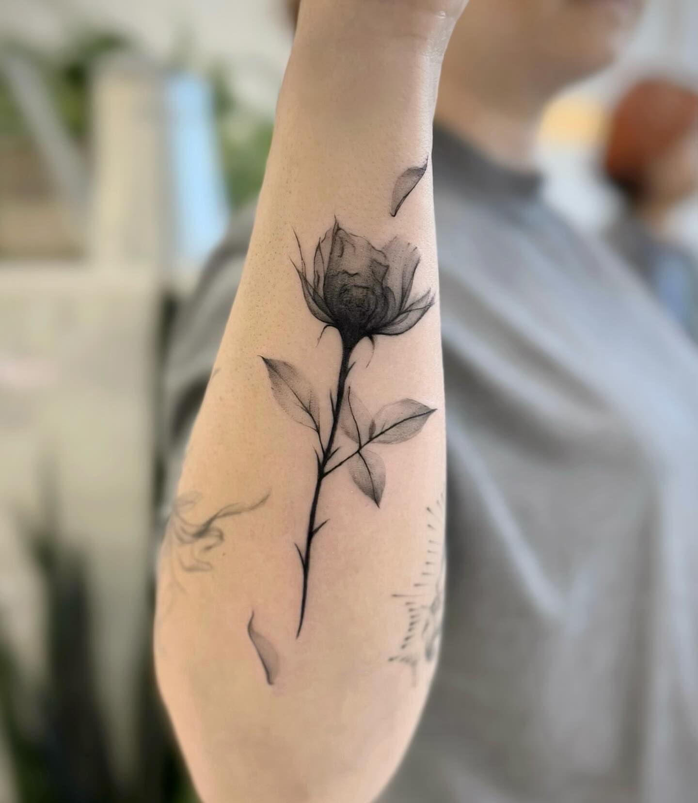 Flower black and grey tattoo on the forearm by David H.