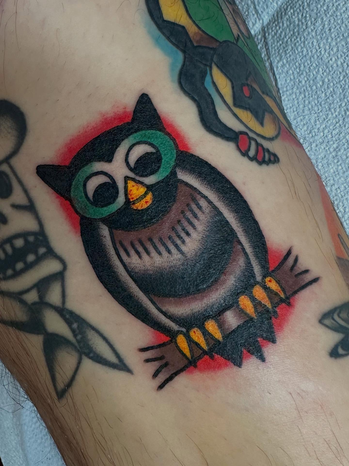 Owl American traditional tattoo on the forearm by Steven