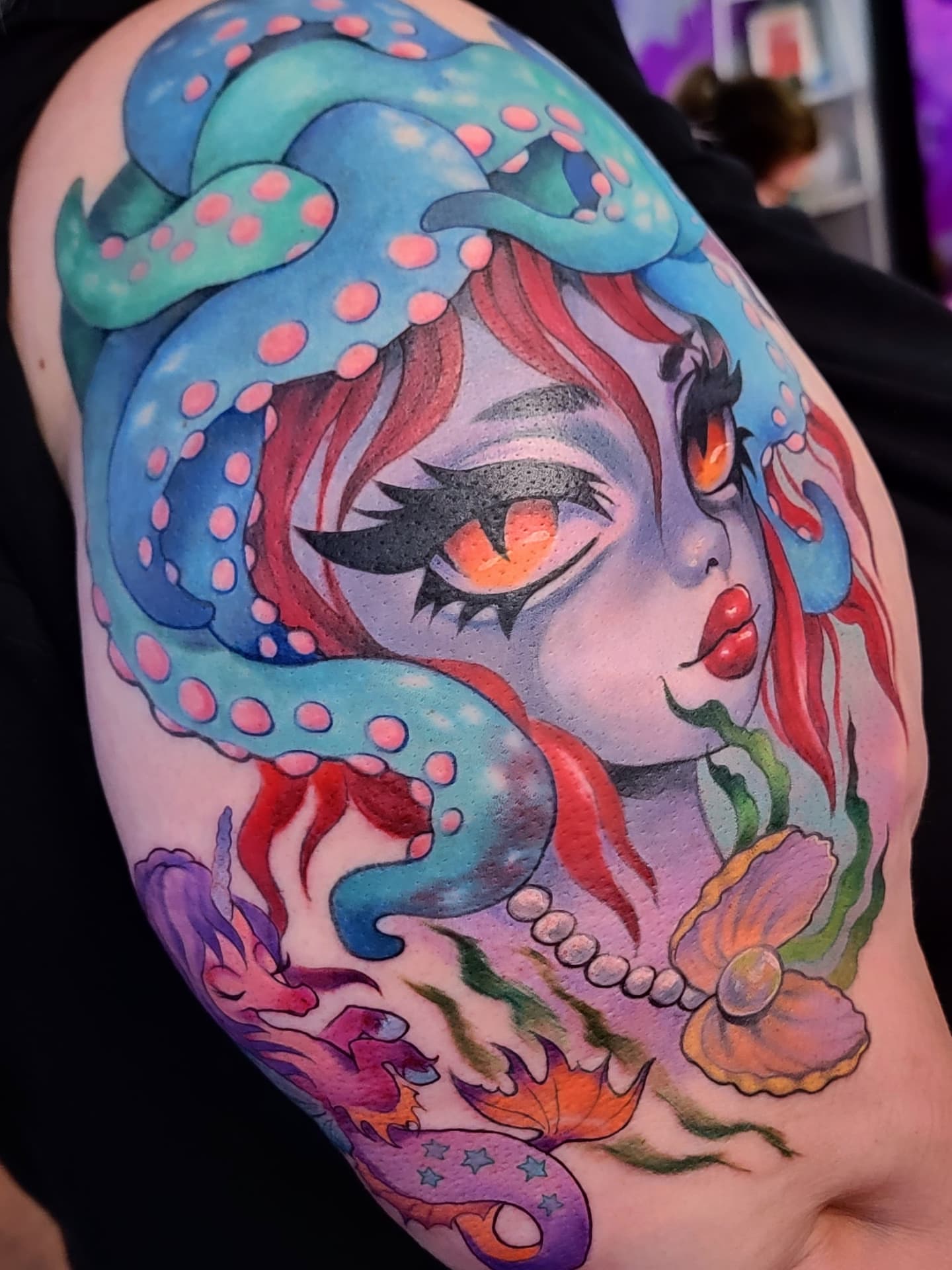 Mermaid new school tattoo on the shoulder by Kerry Rose