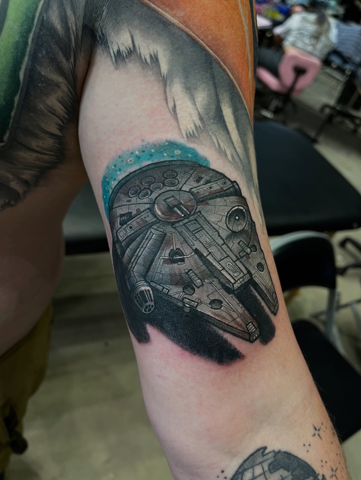 Millennium Falcon realism tattoo on the forearm by Chris Sparks, I just go by Sparks.