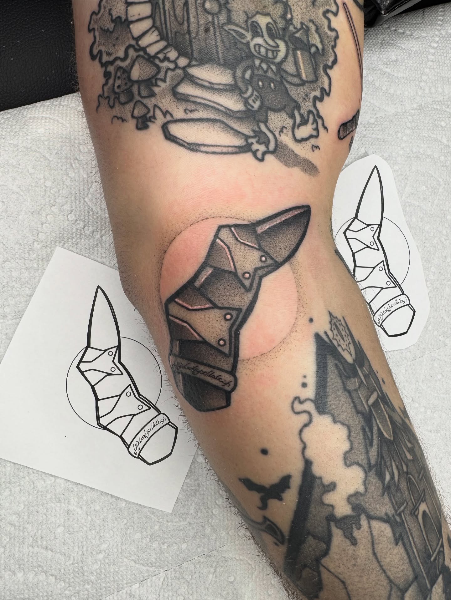 Boot black and grey tattoo on the forearm by Donnie Moore