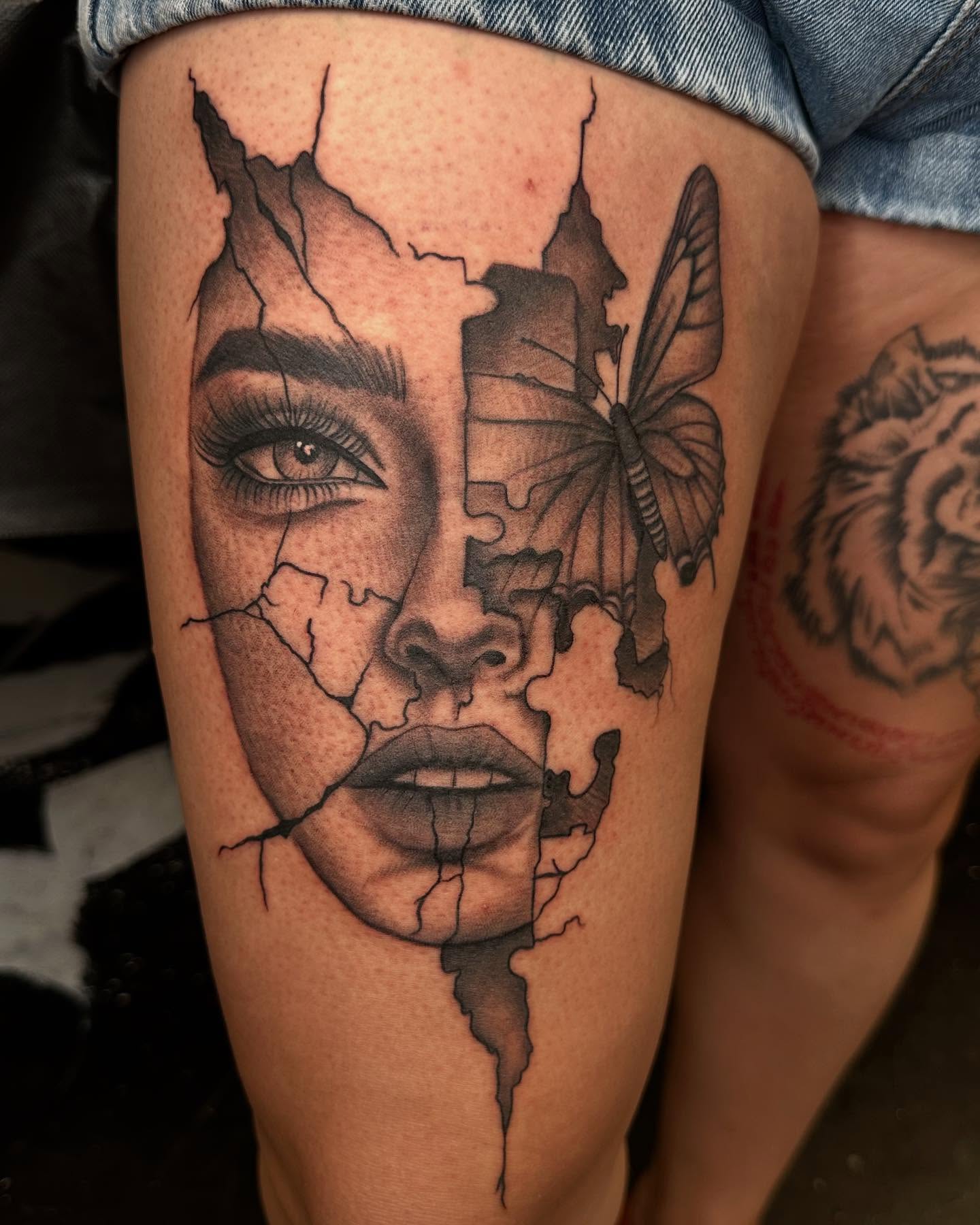 Woman's face realism tattoo on the thigh by Kimberly landin