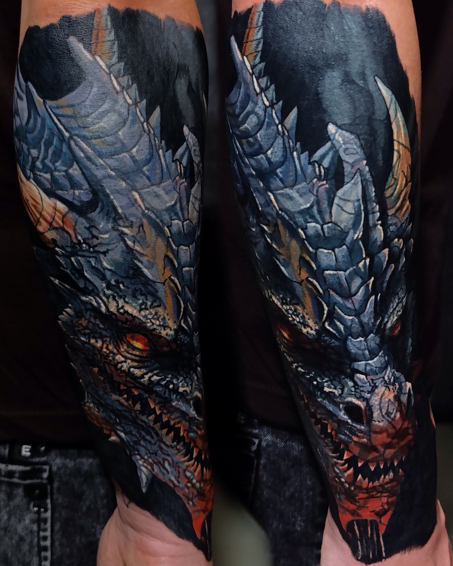 Dragon dark realism tattoo on the forearm by Vladimir Lutaev