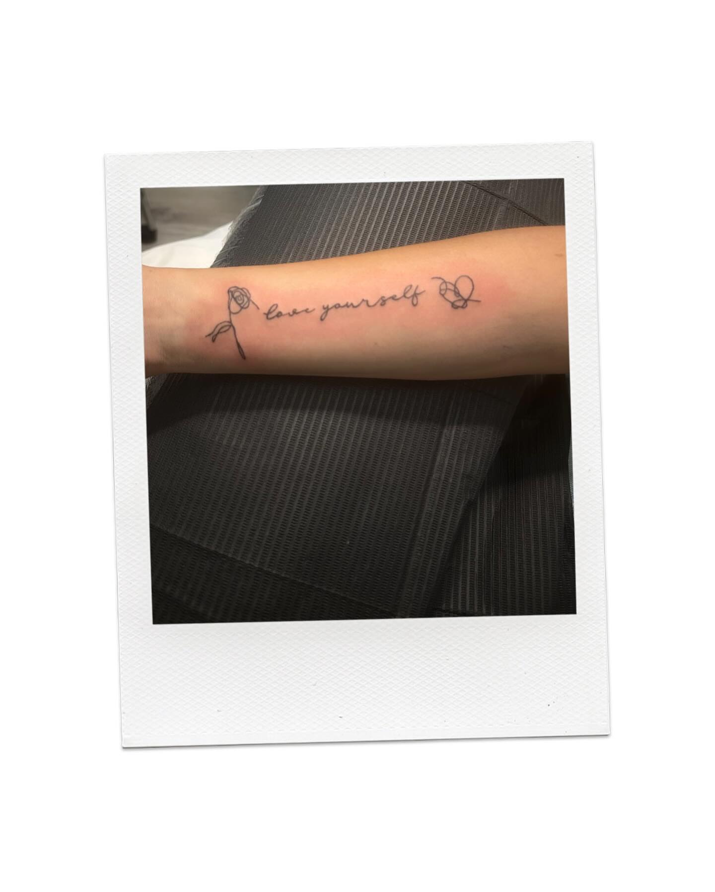 Love yourself lettering script tattoo on the forearm by Victoria Cooper