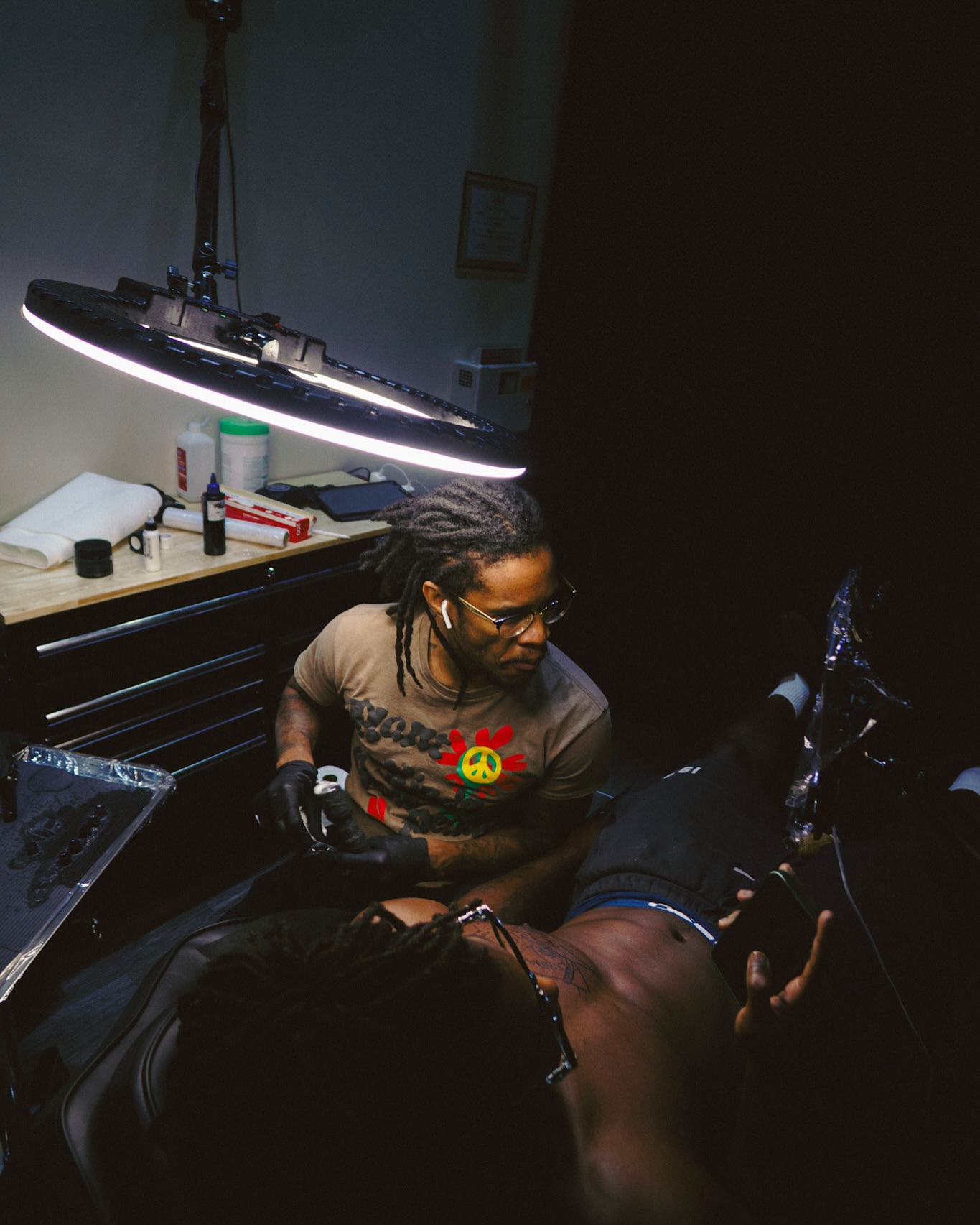 Tattoo artist American traditional tattoo on the upper arm by Lucky Lefty