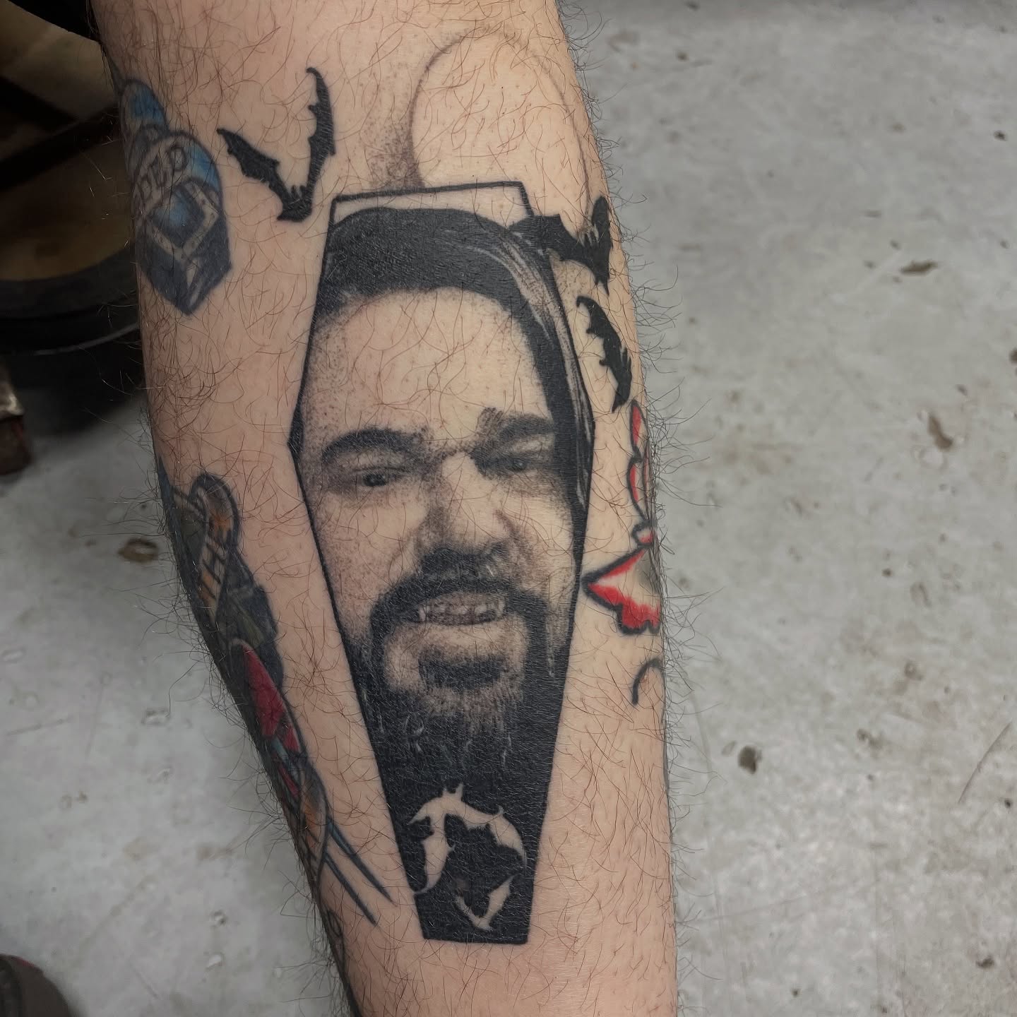 Portrait realism tattoo on the forearm by Ian Spong