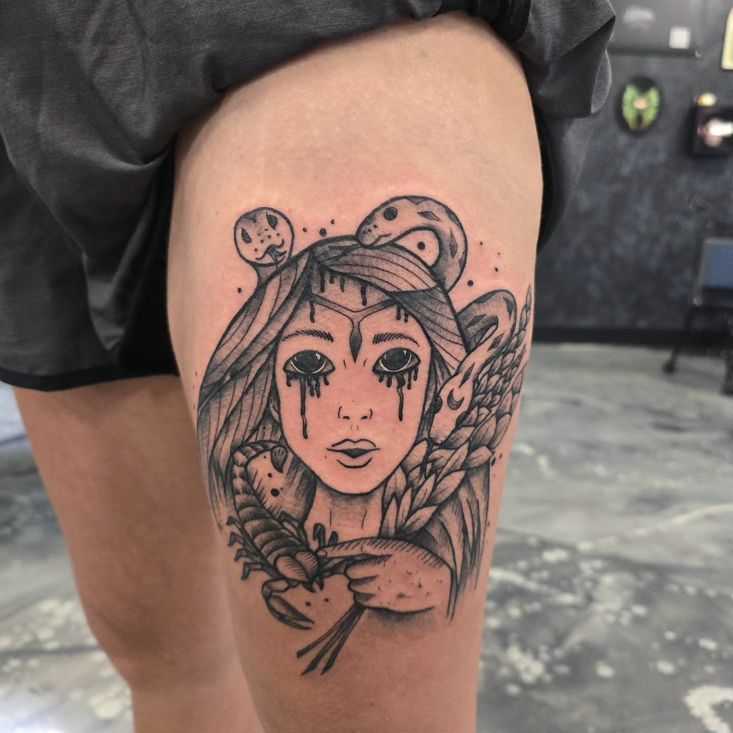 Woman with snakes realism tattoo on the thigh by Jon Griffin, Maryville, Tennessee