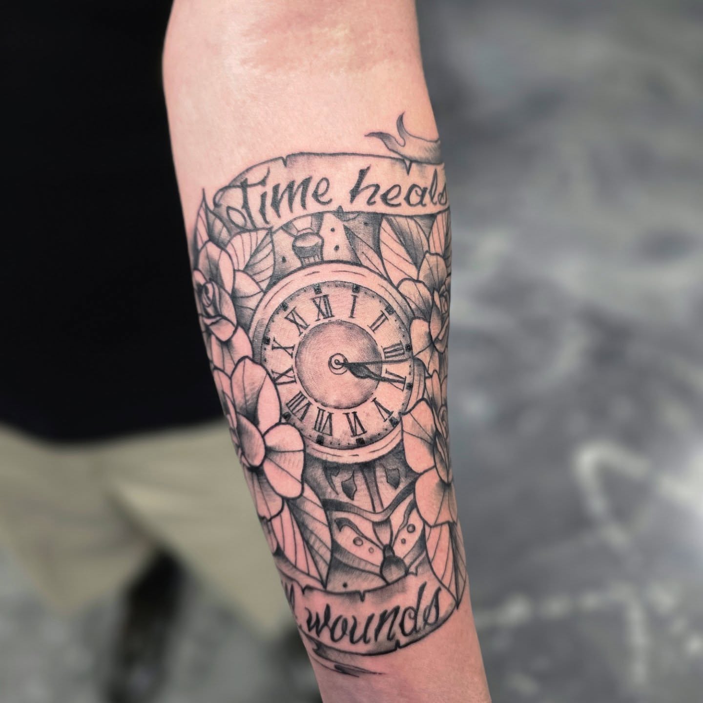 Clock and flowers geometric tattoo on the forearm by Jon Griffin, Maryville, Tennessee