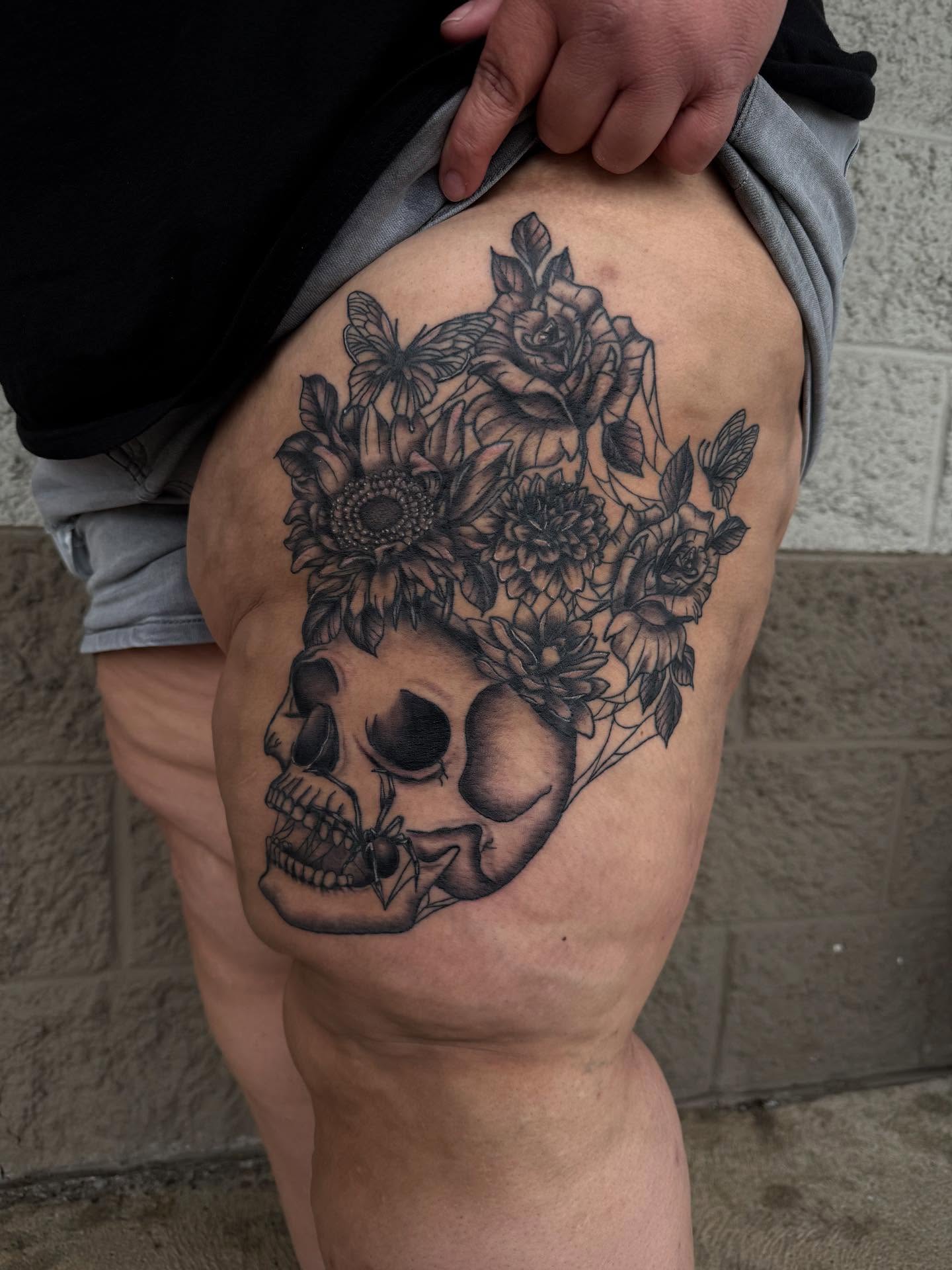 Skull with floral crown realism tattoo on the thigh by Kylee langford 🧿