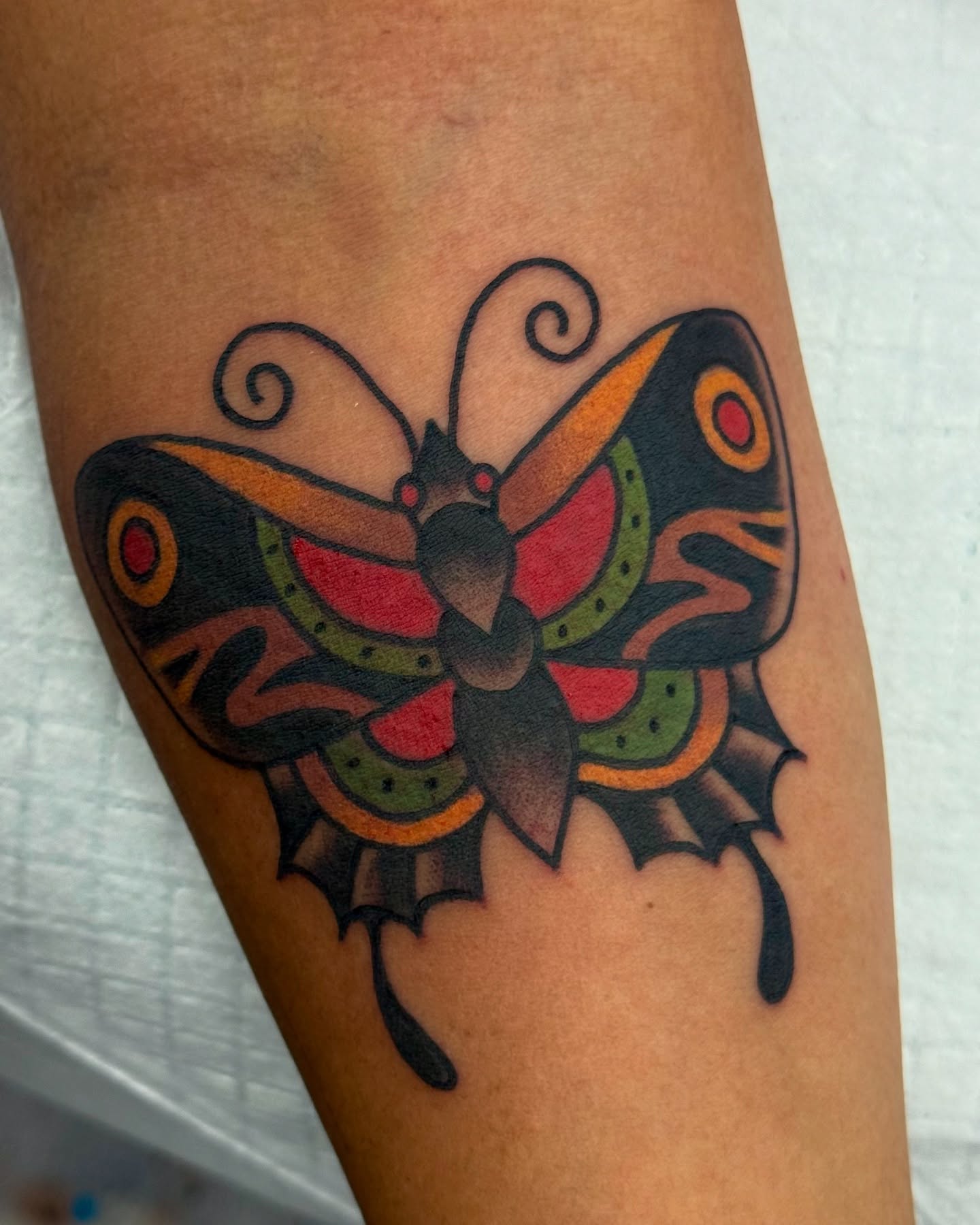 Butterfly American traditional tattoo on the forearm by Marcos Rivera, Laredo, Texas