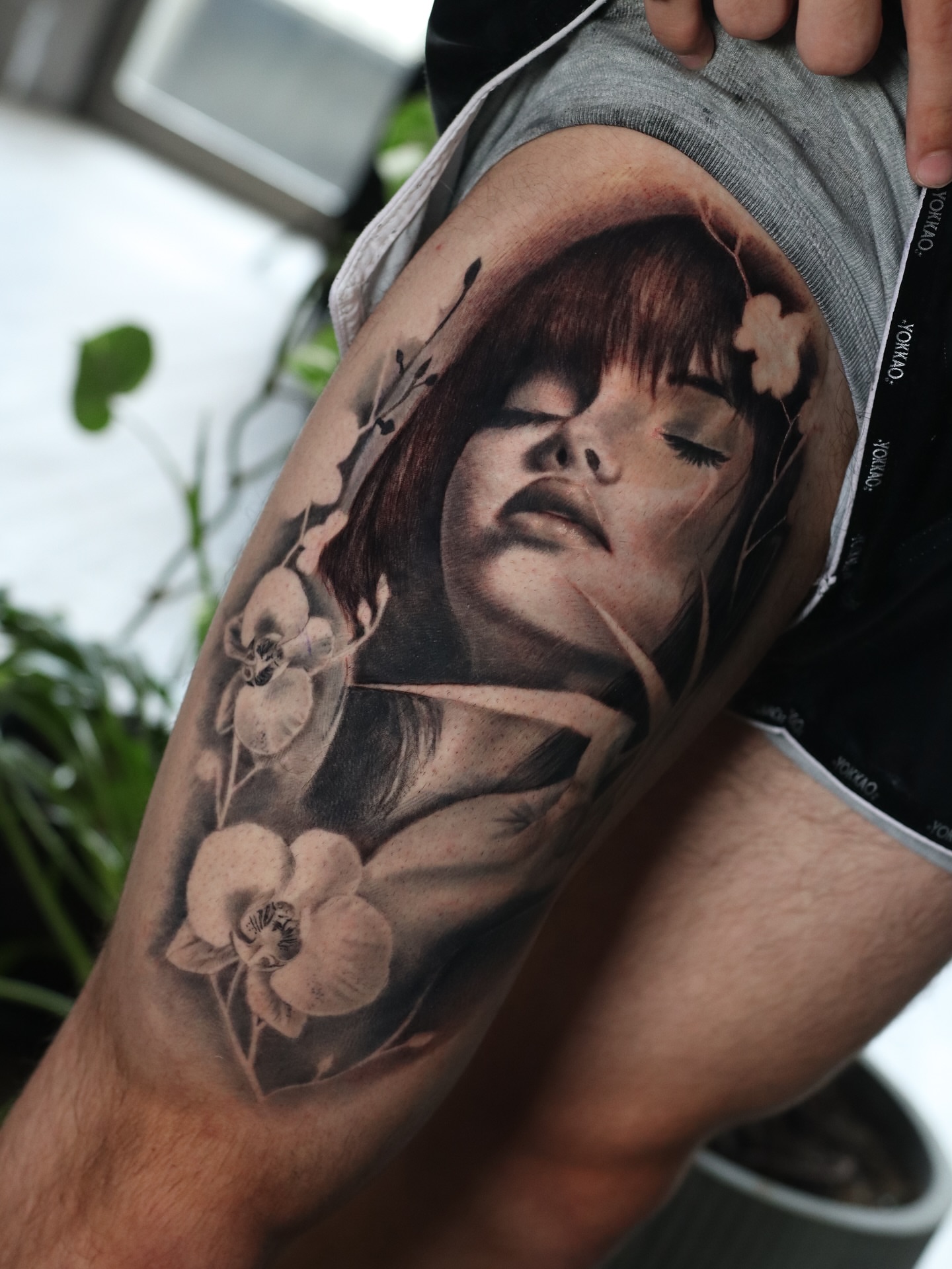 Woman with flowers realism tattoo on the forearm by Naomi Burke, New Westminster, British Columbia