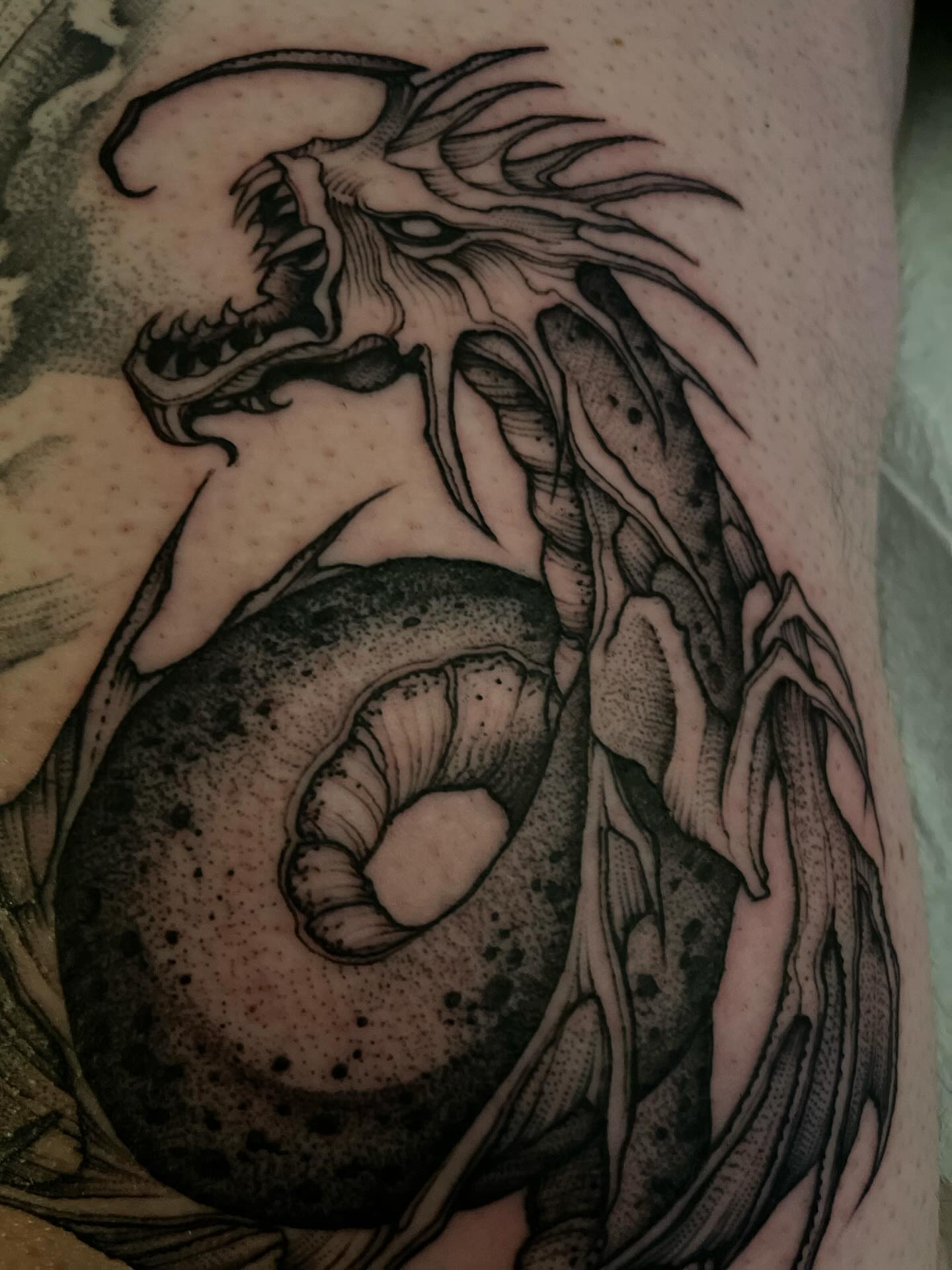 Dragon dotwork tattoo on the forearm by Jacob Kearney
