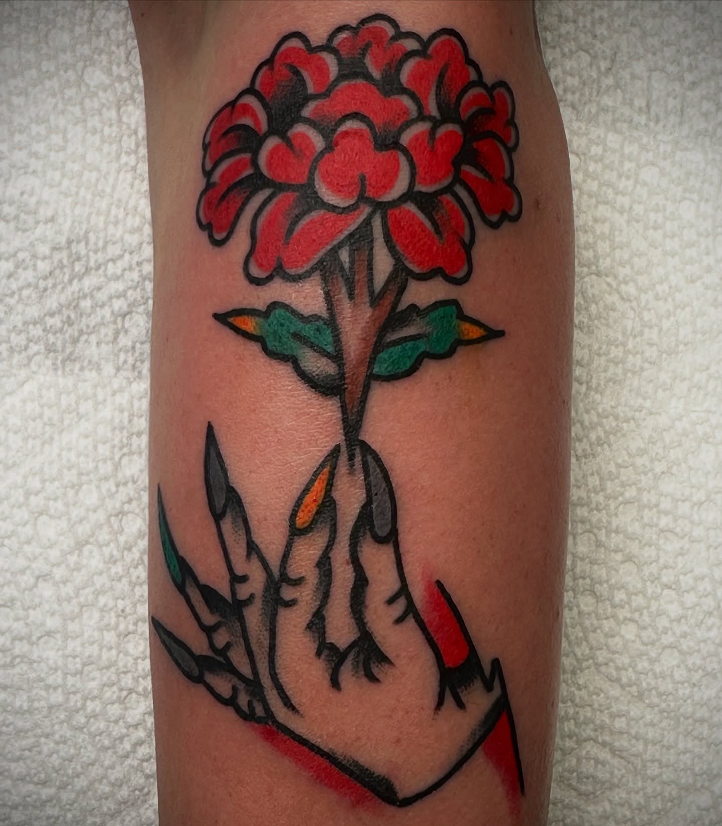 Red flower American traditional tattoo on the forearm by Kyle O’Hara ॐ, Nashville, Tennessee