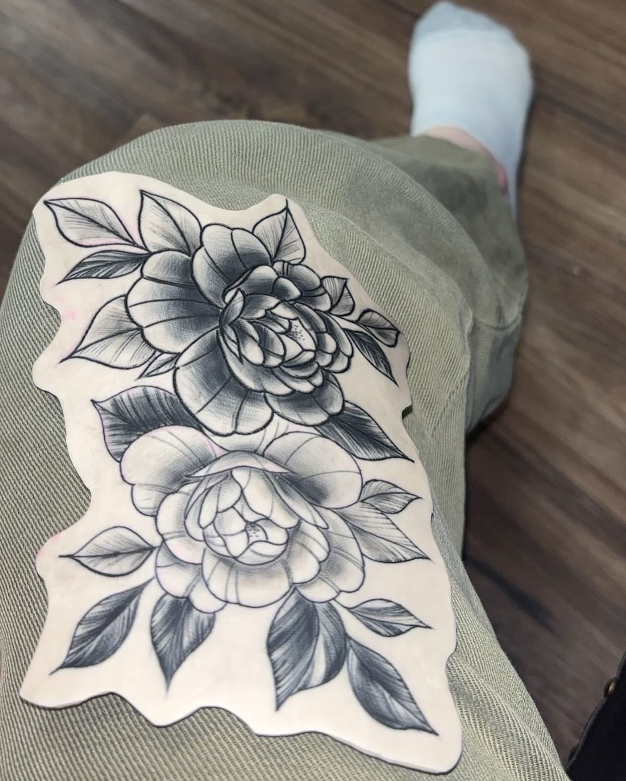 Peony flowers black and grey tattoo on the thigh by Molly Dixon