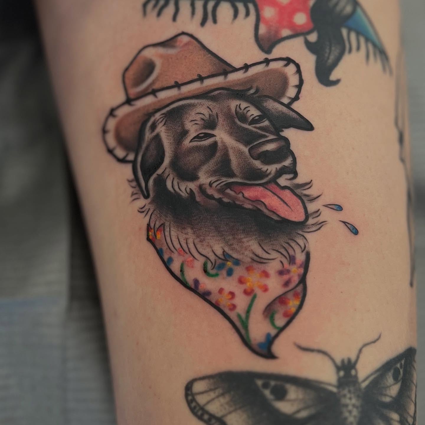 Dog wearing sombrero American traditional tattoo on the forearm by l y n d s e y r i c k e t t s